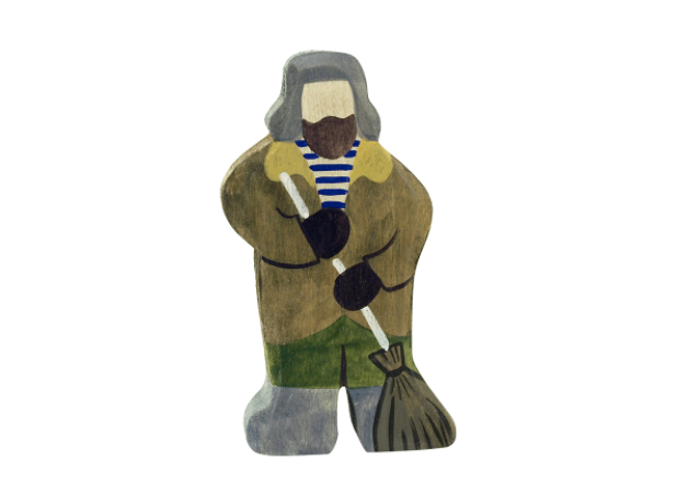 Wooden figurine of a person holding a broom on a white background