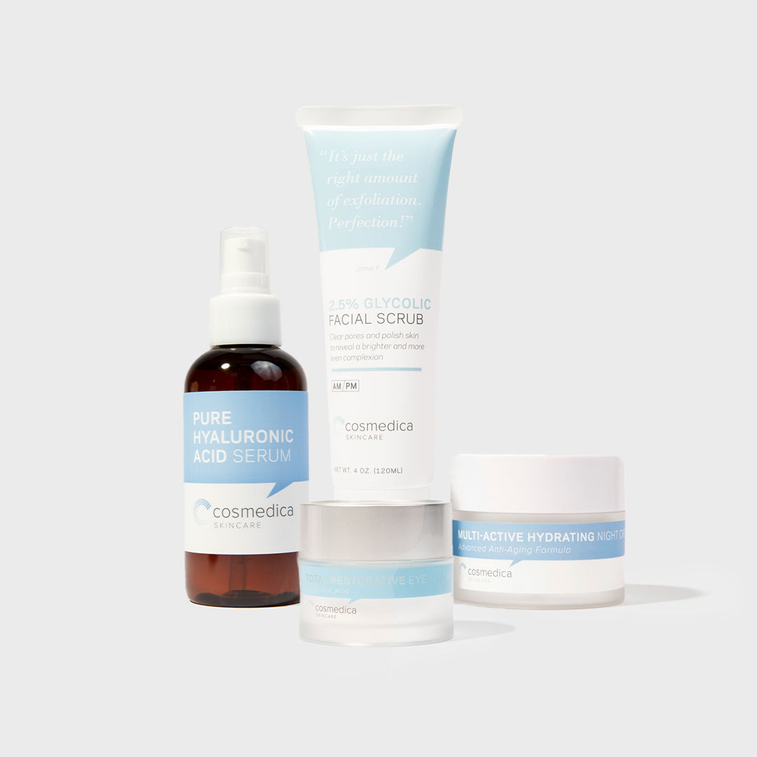 Cosmedica skincare products including a serum, scrub, and cream on a light gray background