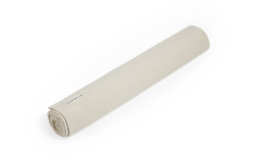 Roll of beige fabric on a white background
