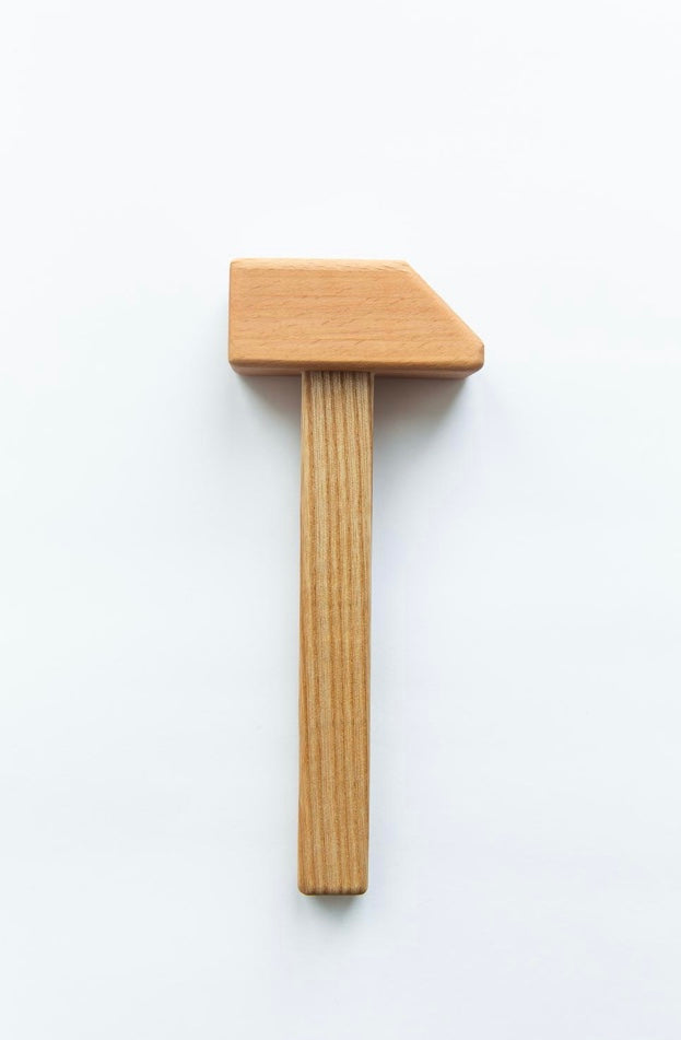 Wooden tool with a rectangular head on a white background