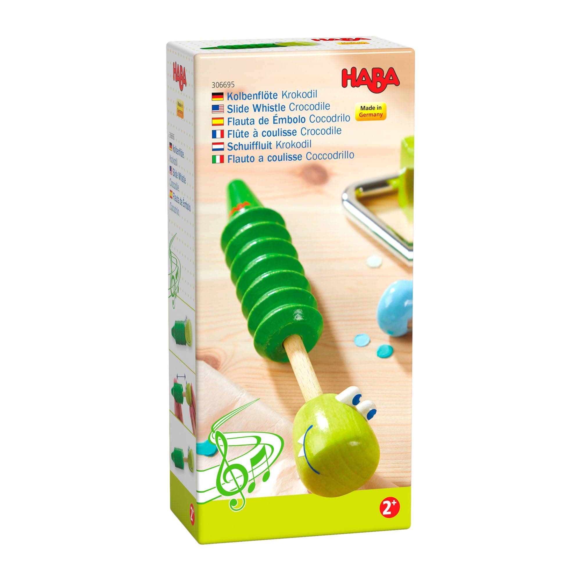 HABA slide whistle packaging with green slide whistle illustration on a white background