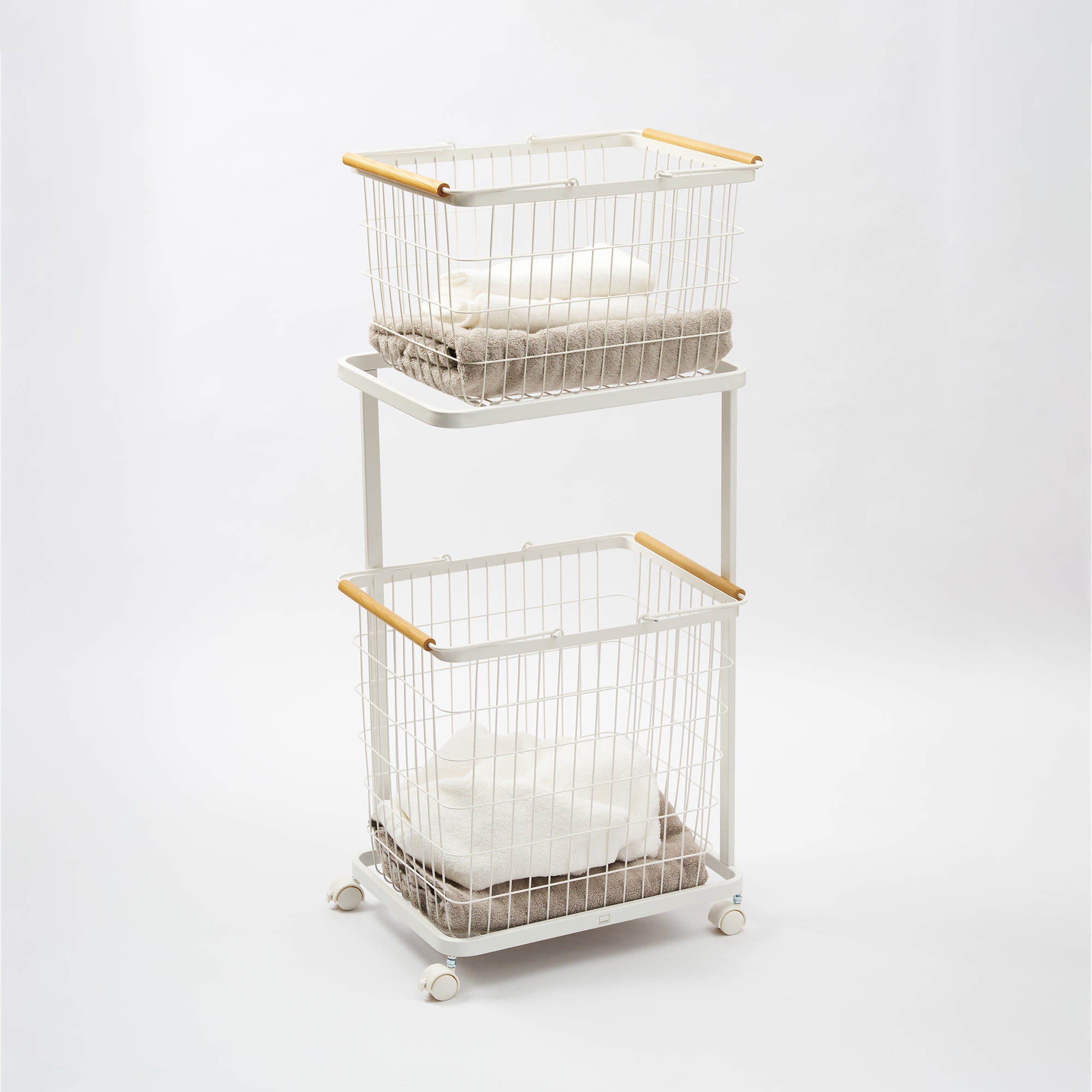 Two-tier metal storage cart with wire baskets on a white background