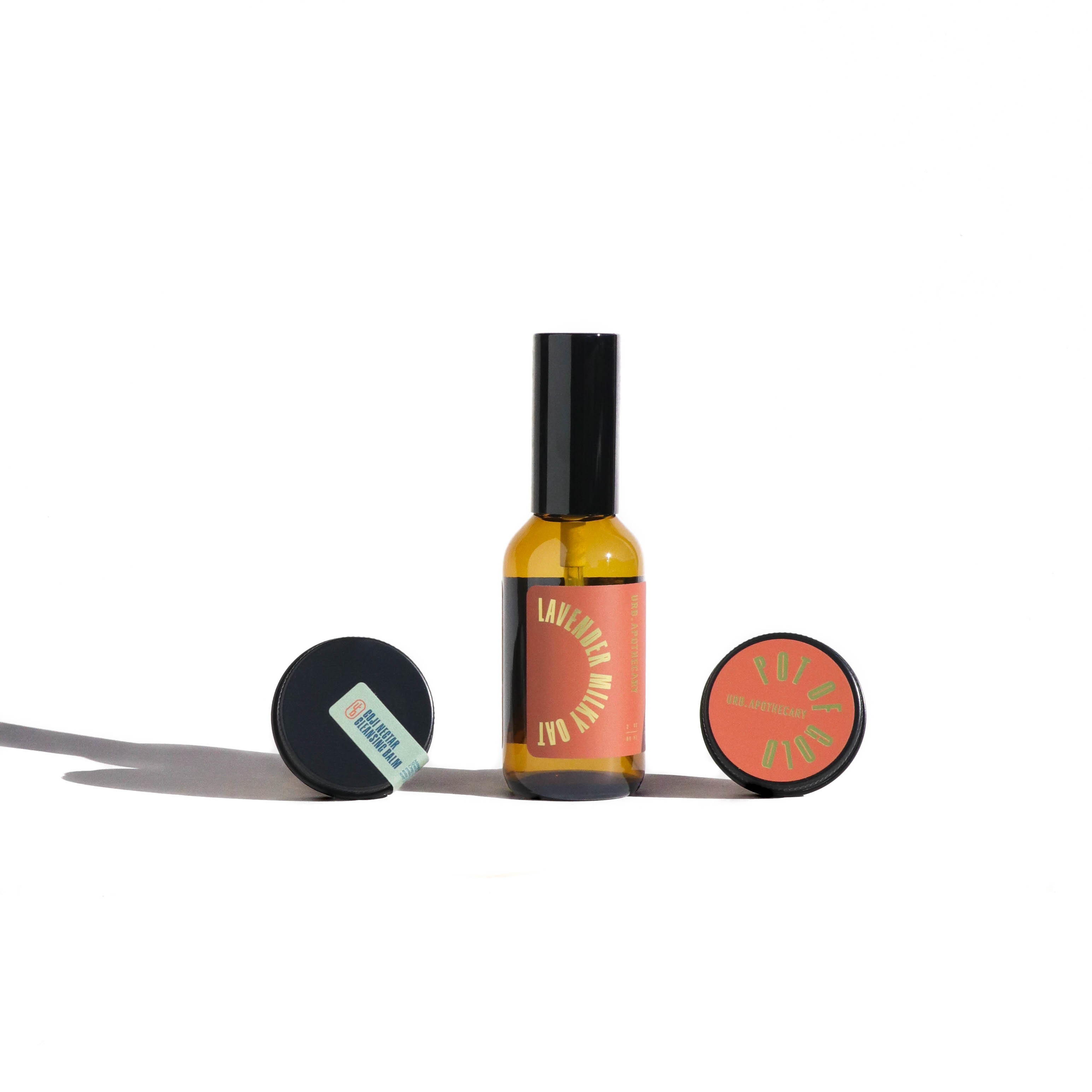 Skincare product set with bottle and round container on a white background
