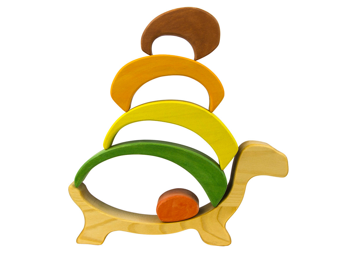 Wooden toy with colorful rings on a white background