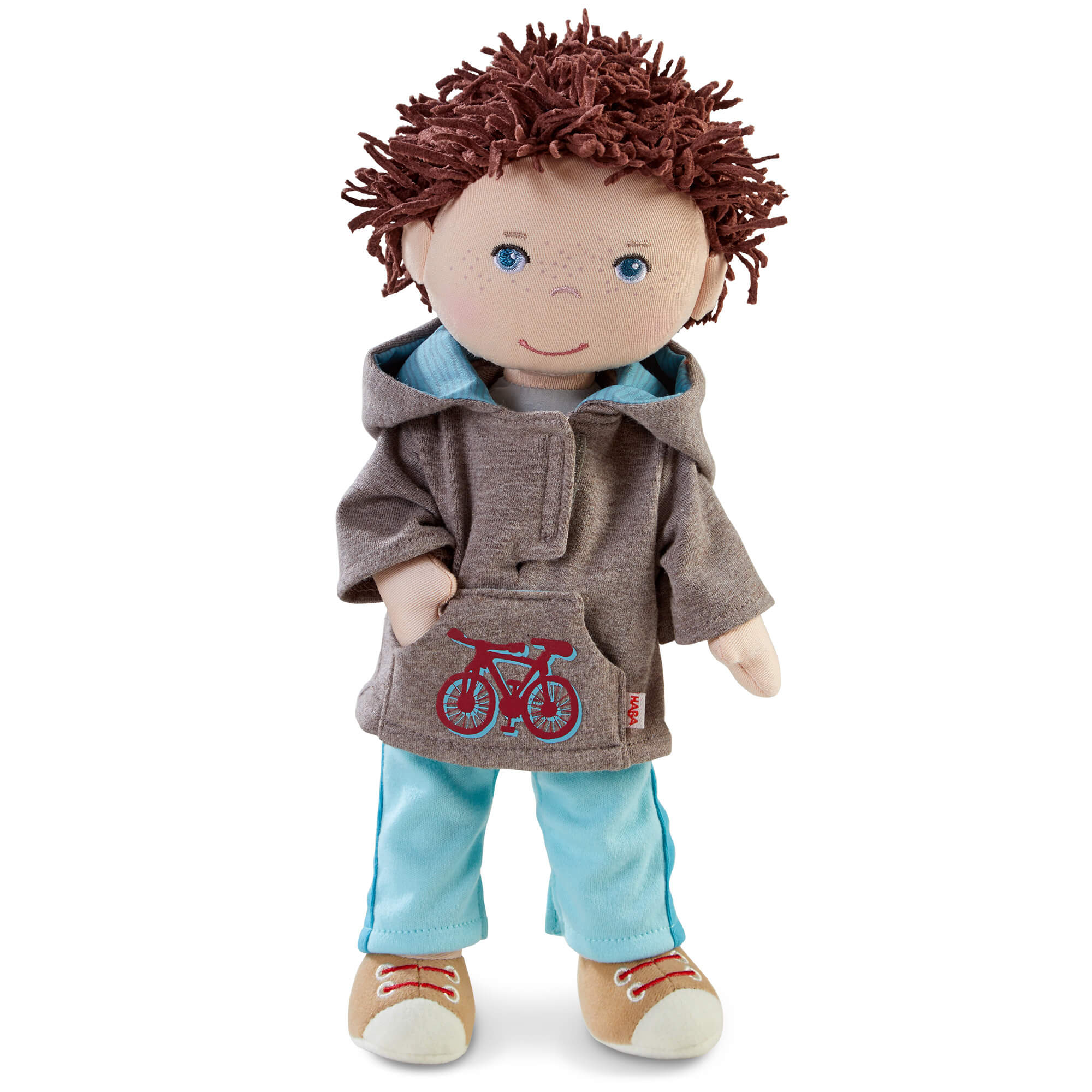 Doll with brown hair wearing a brown jacket with a bicycle emblem on a white background