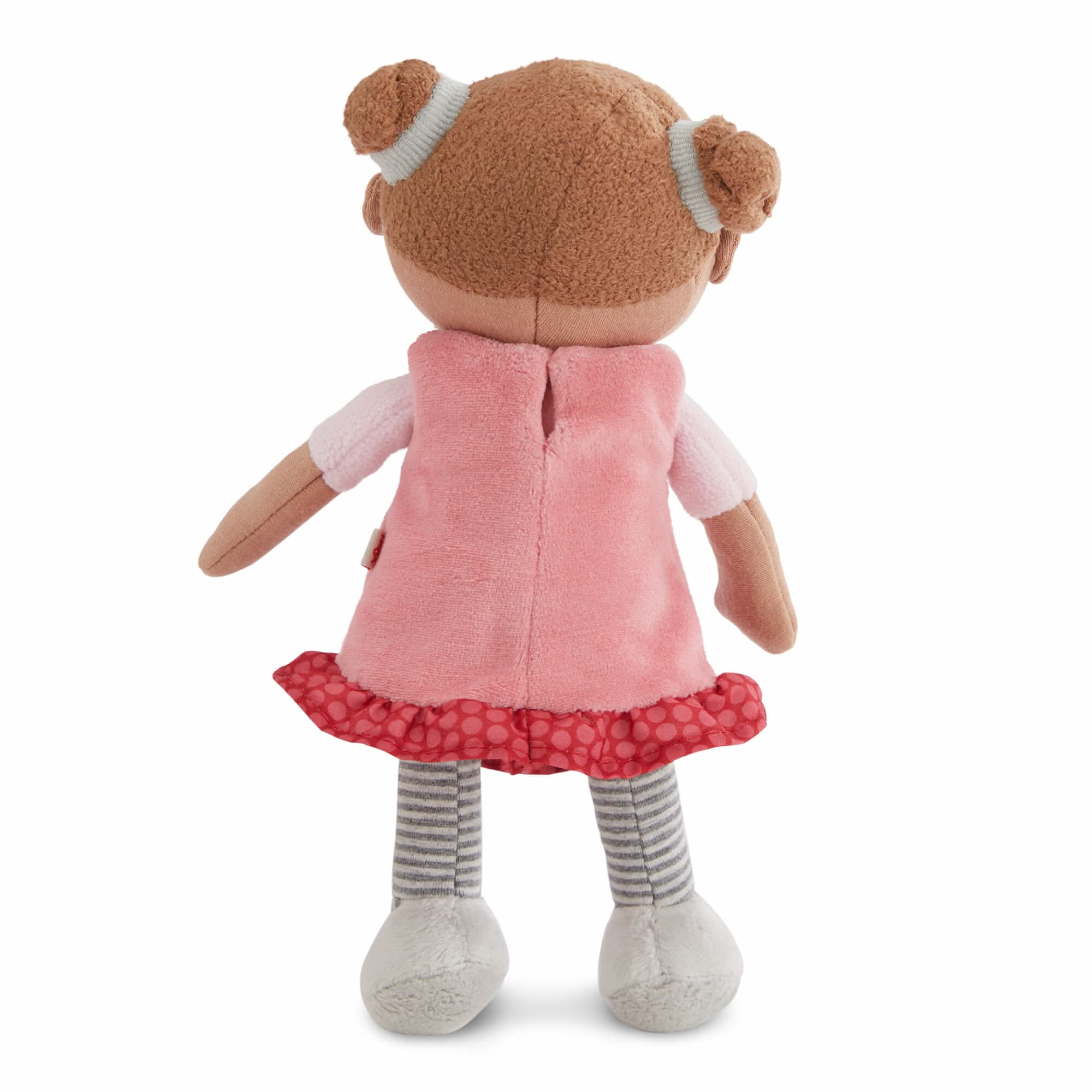 Stuffed toy with a pink dress and striped socks on a white background