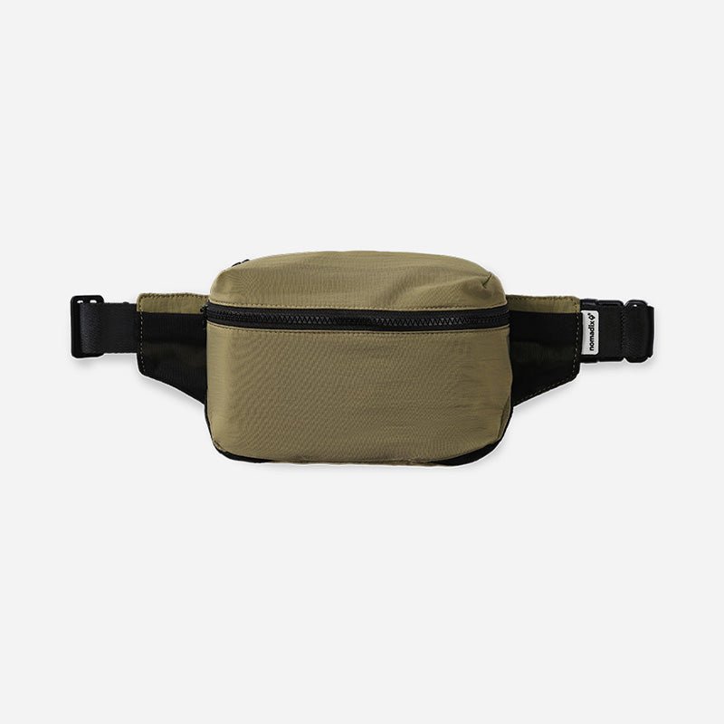 Khaki waist bag with black strap on a white background
