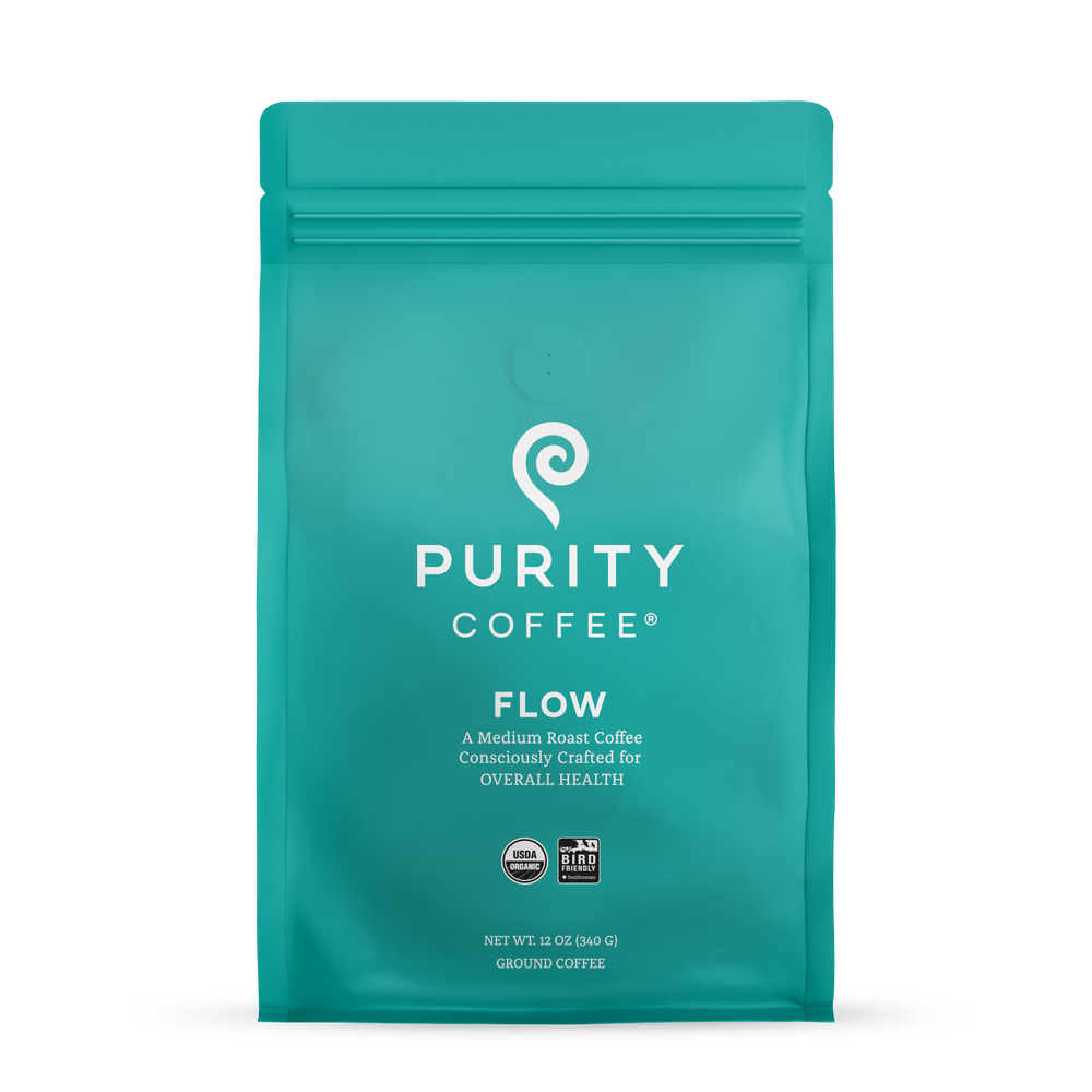 Teal coffee bag with 'Purity Coffee' branding on a white background
