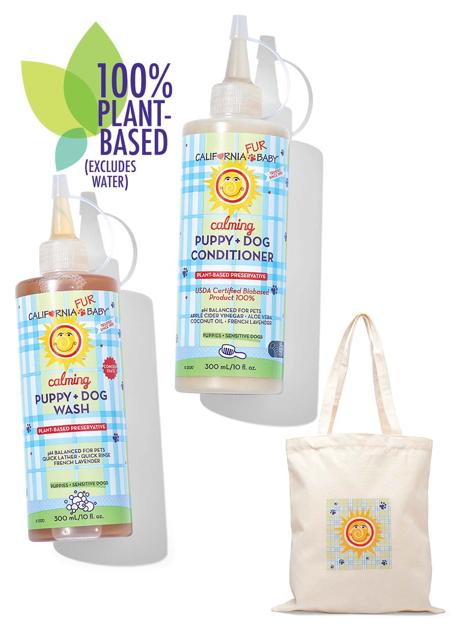 California Baby dog wash and conditioner bottles with a tote bag featuring the brand logo on a white background.