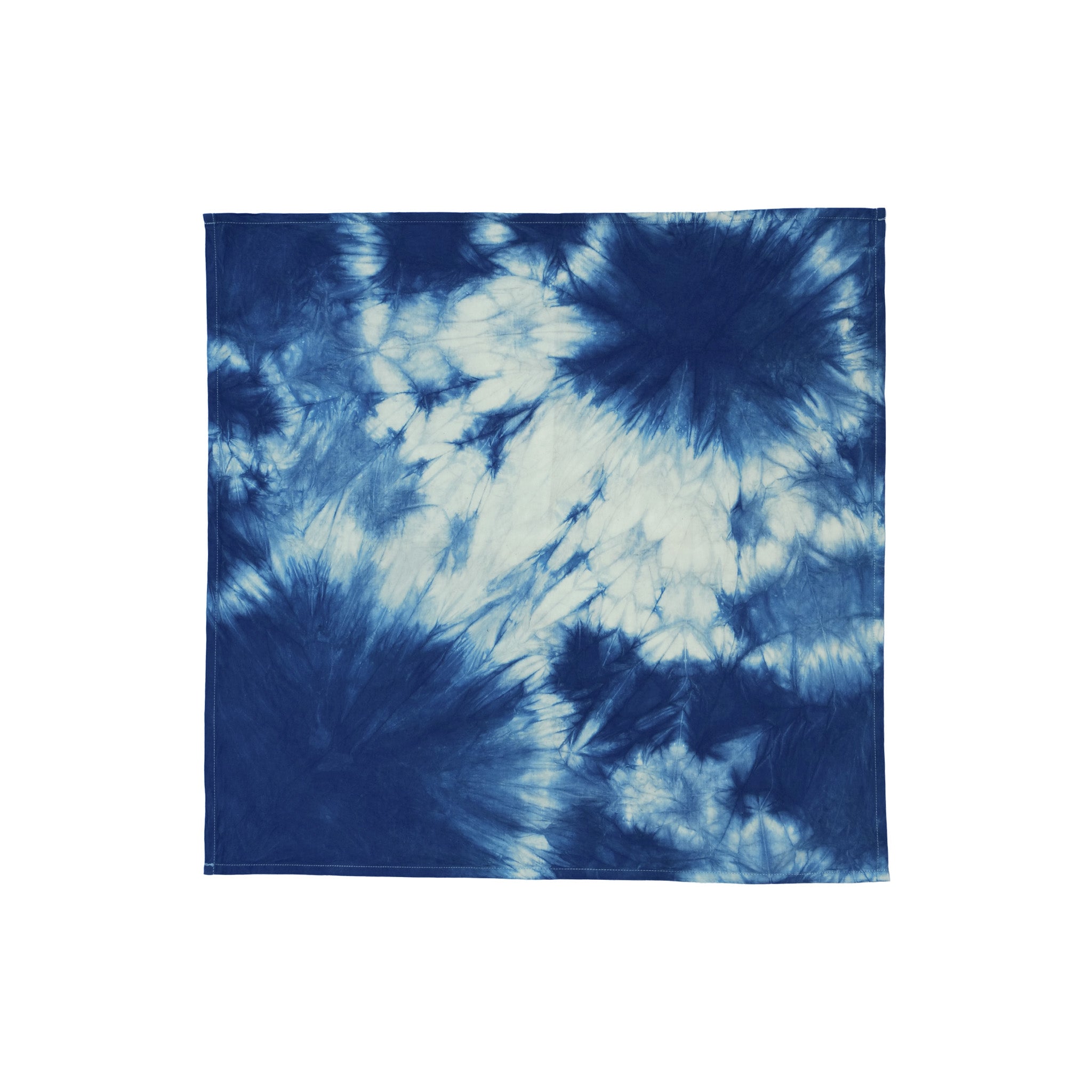 Tie-dye fabric with blue and white pattern on a white background