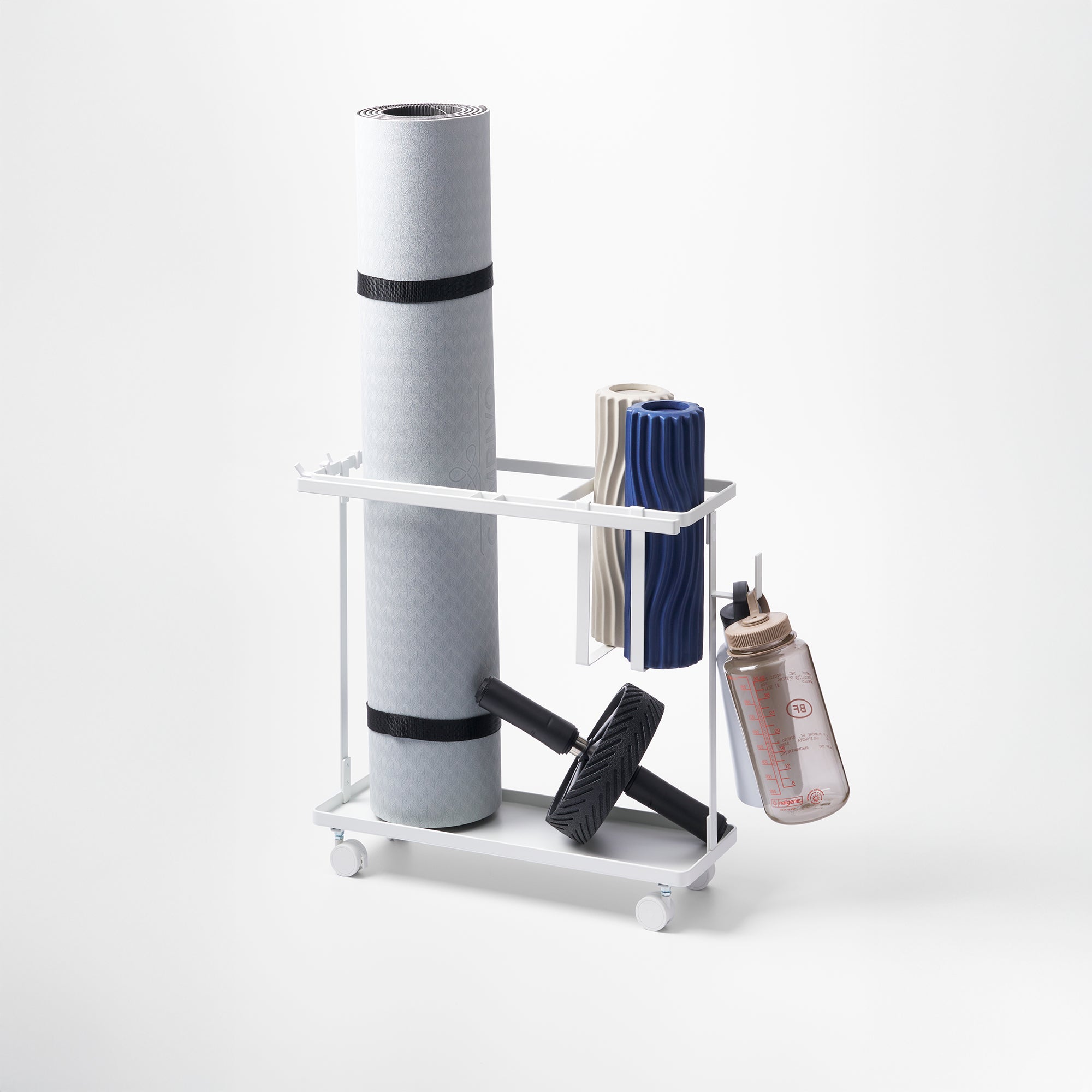White metal storage rack with a yoga mat, dumbbells, and other items on a white background