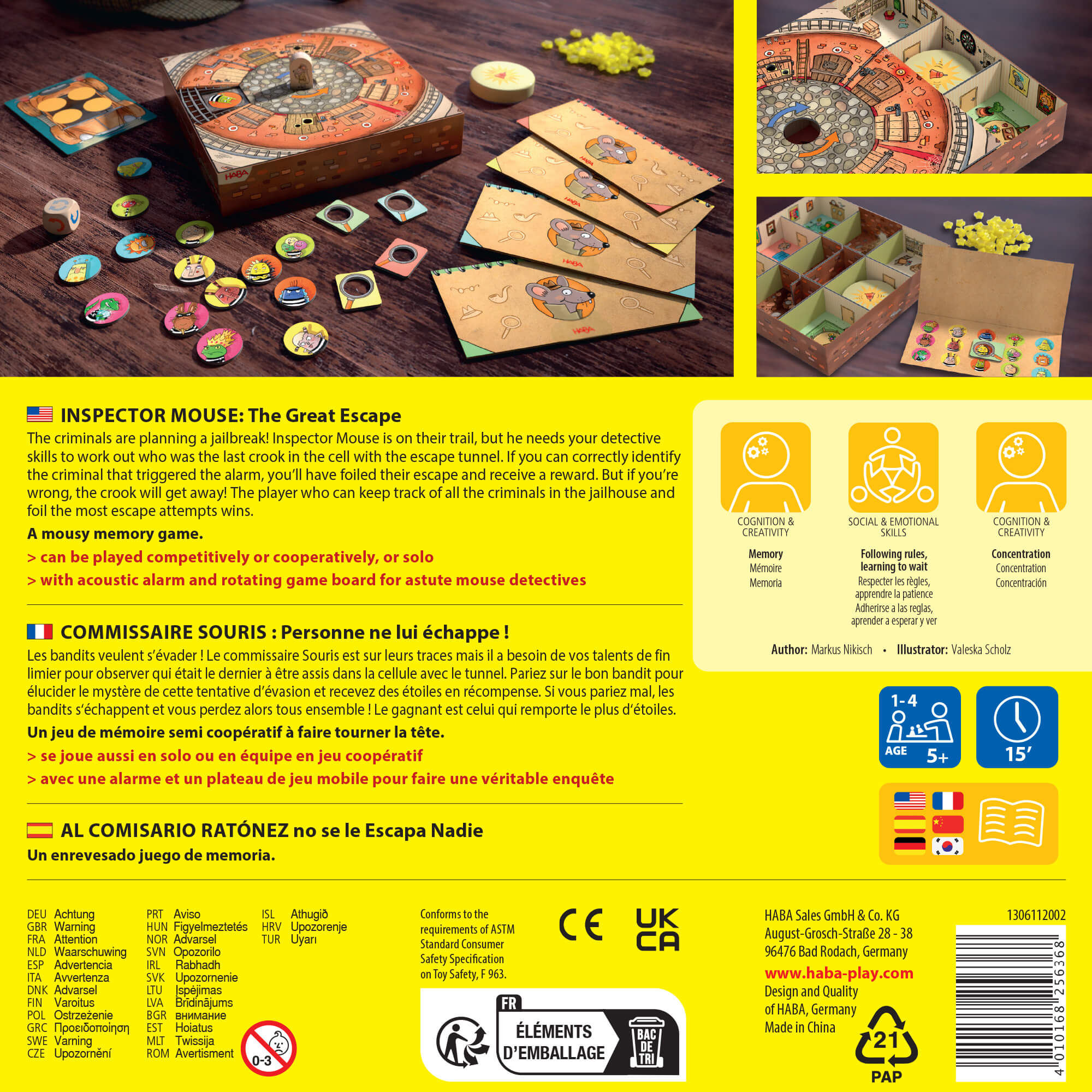 Board game packaging with game pieces and components on a wooden surface