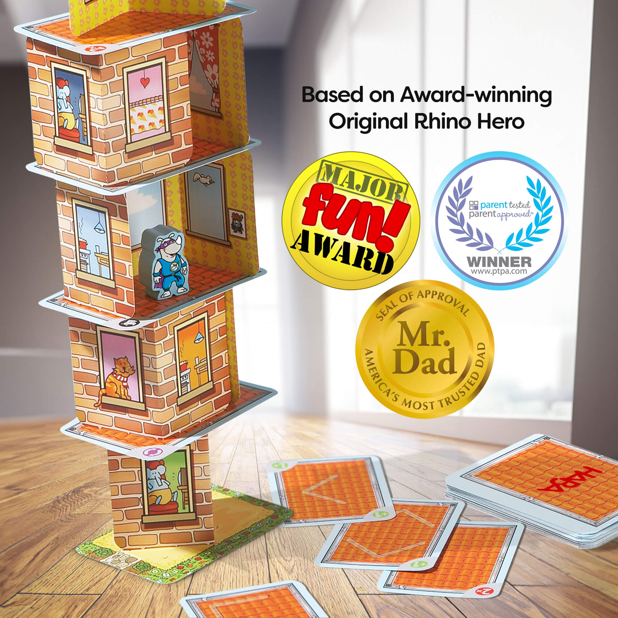 Card game with brick design and cards on a wooden floor, featuring awards and accolades.