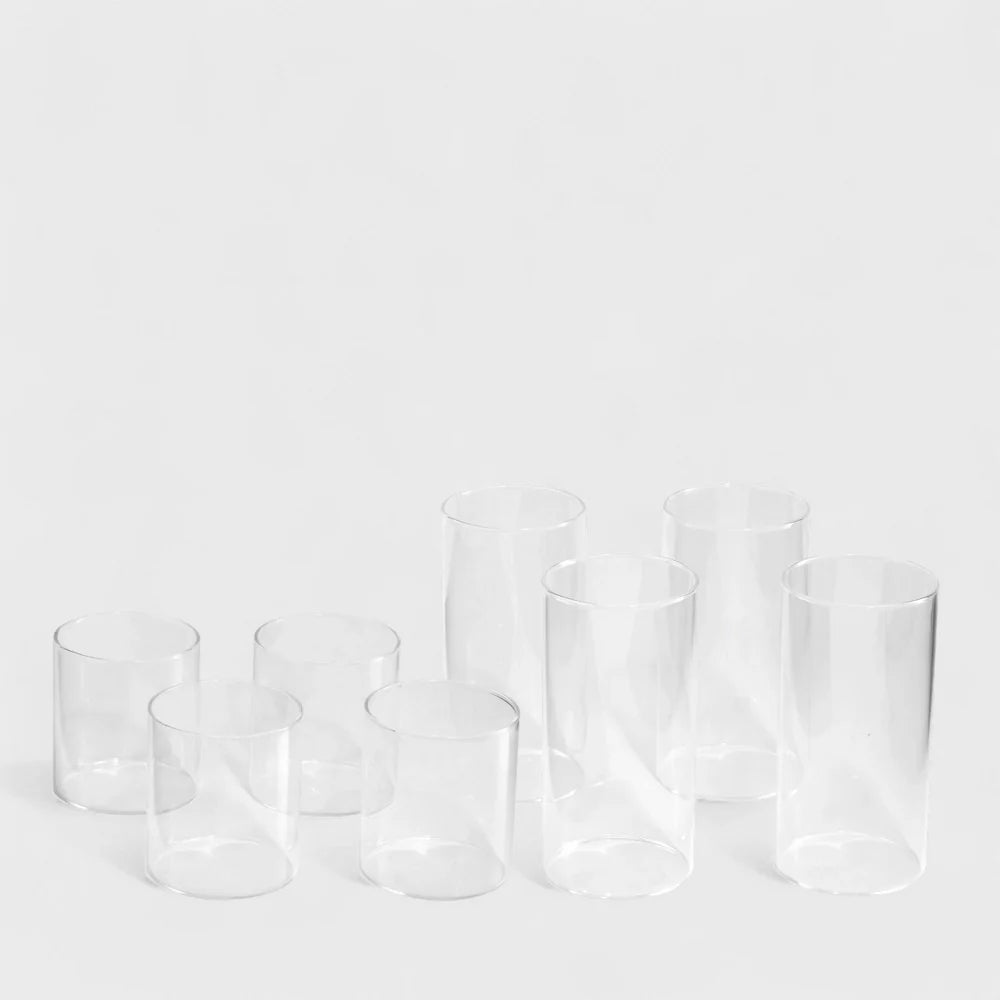 Set of clear glass tumblers on a white background