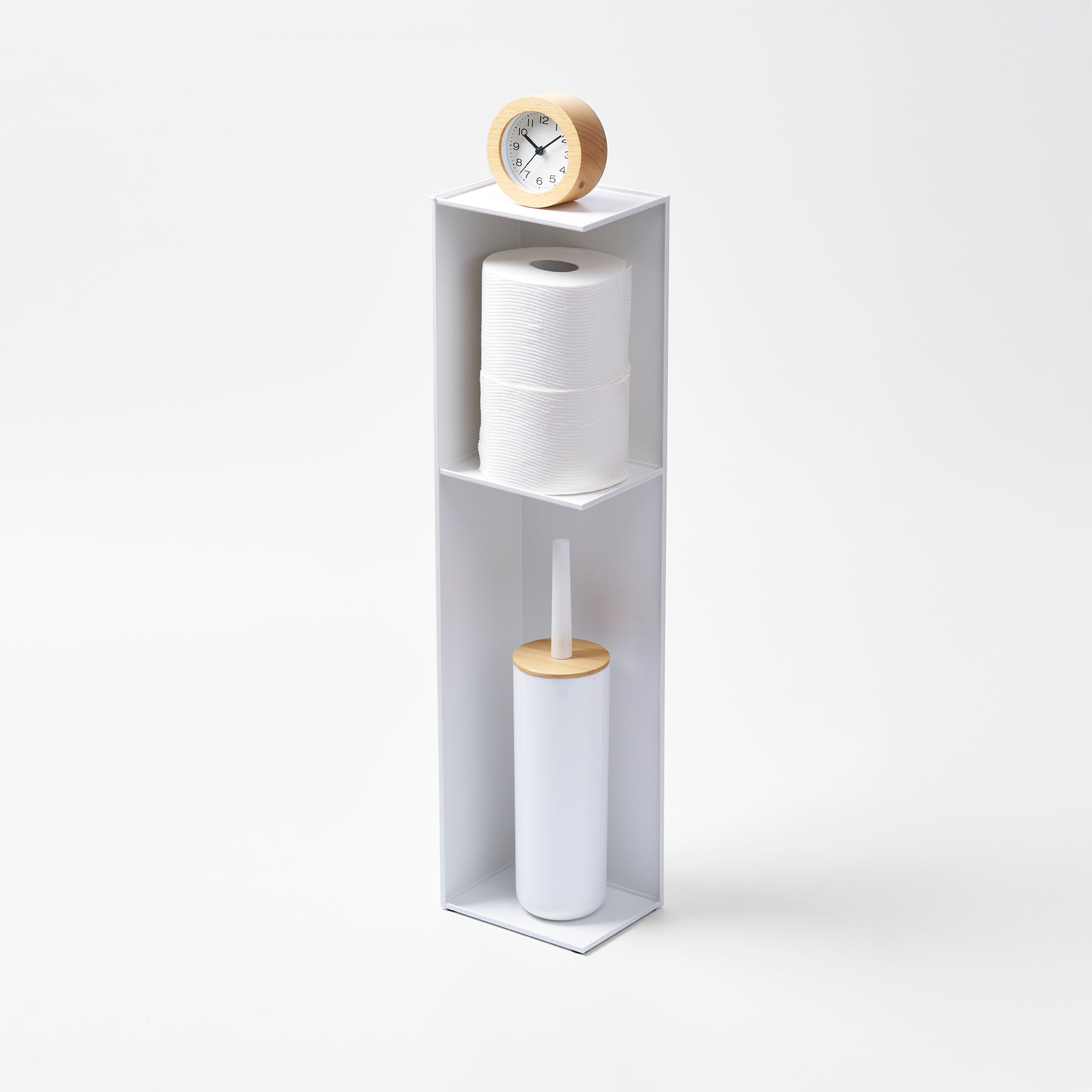 White cylindrical storage tower with a clock on top and cleaning brush inside, on a white background