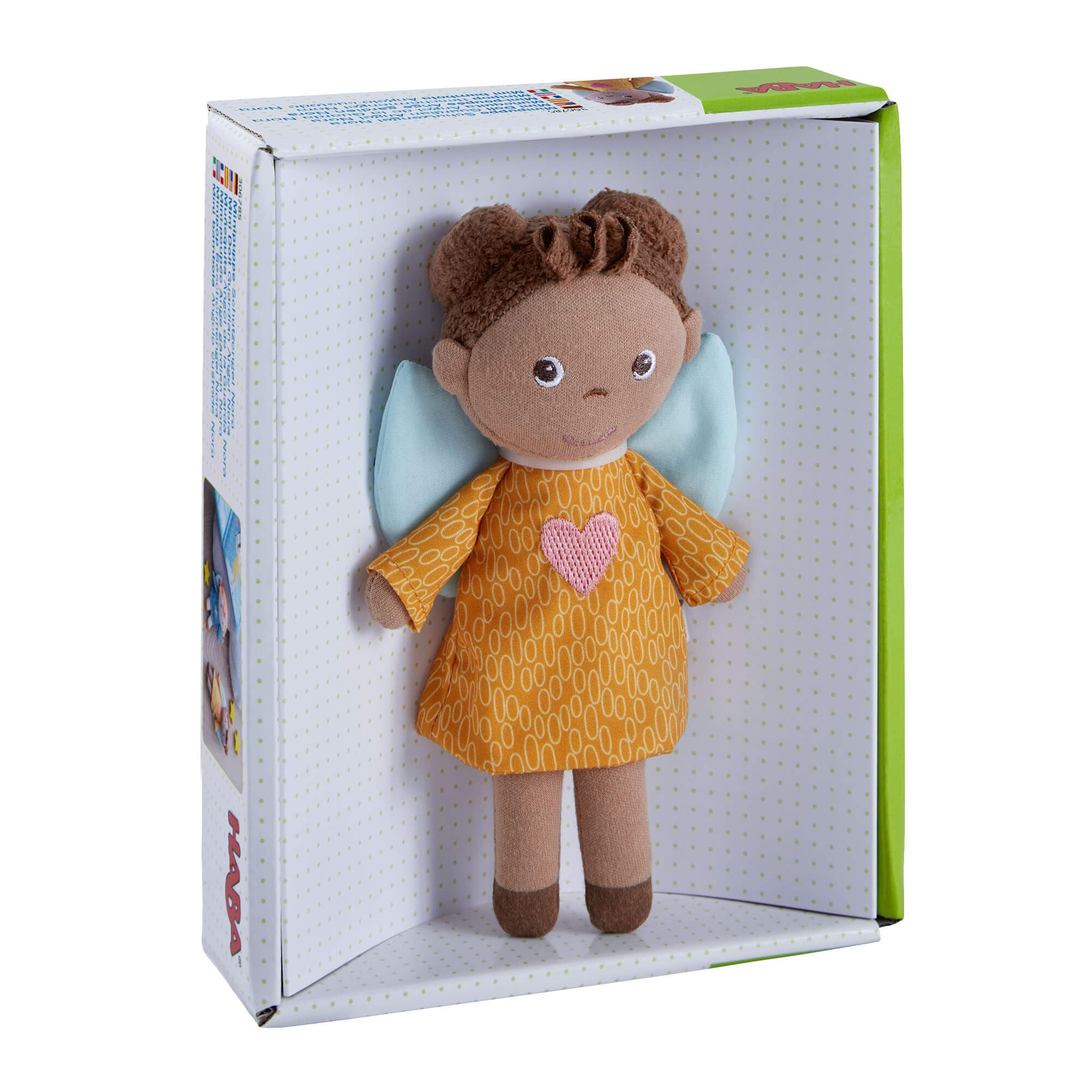 Stuffed toy angel in a yellow dress with a heart on the chest, in a box packaging.