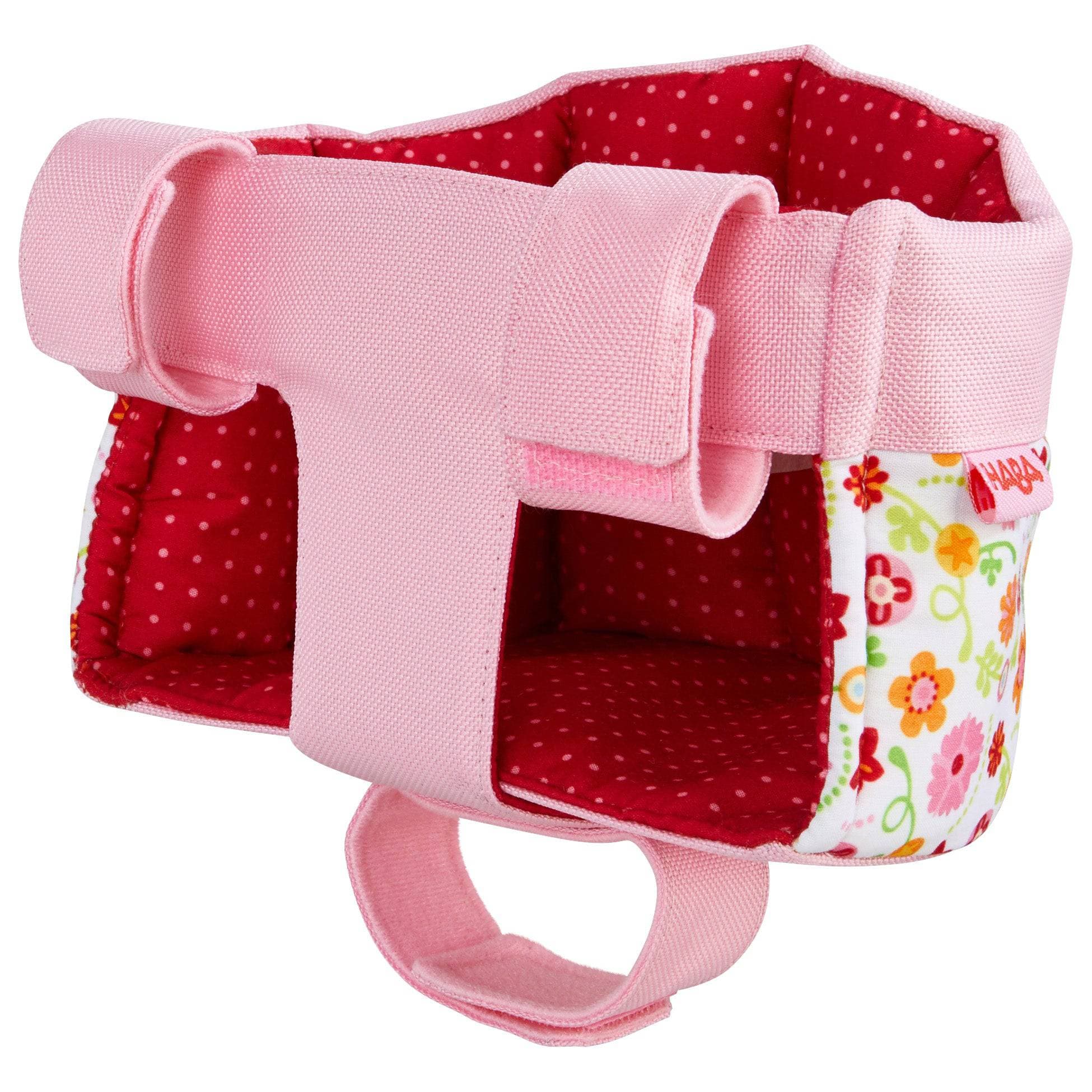 Pink and red dog harness with floral pocket on a white background