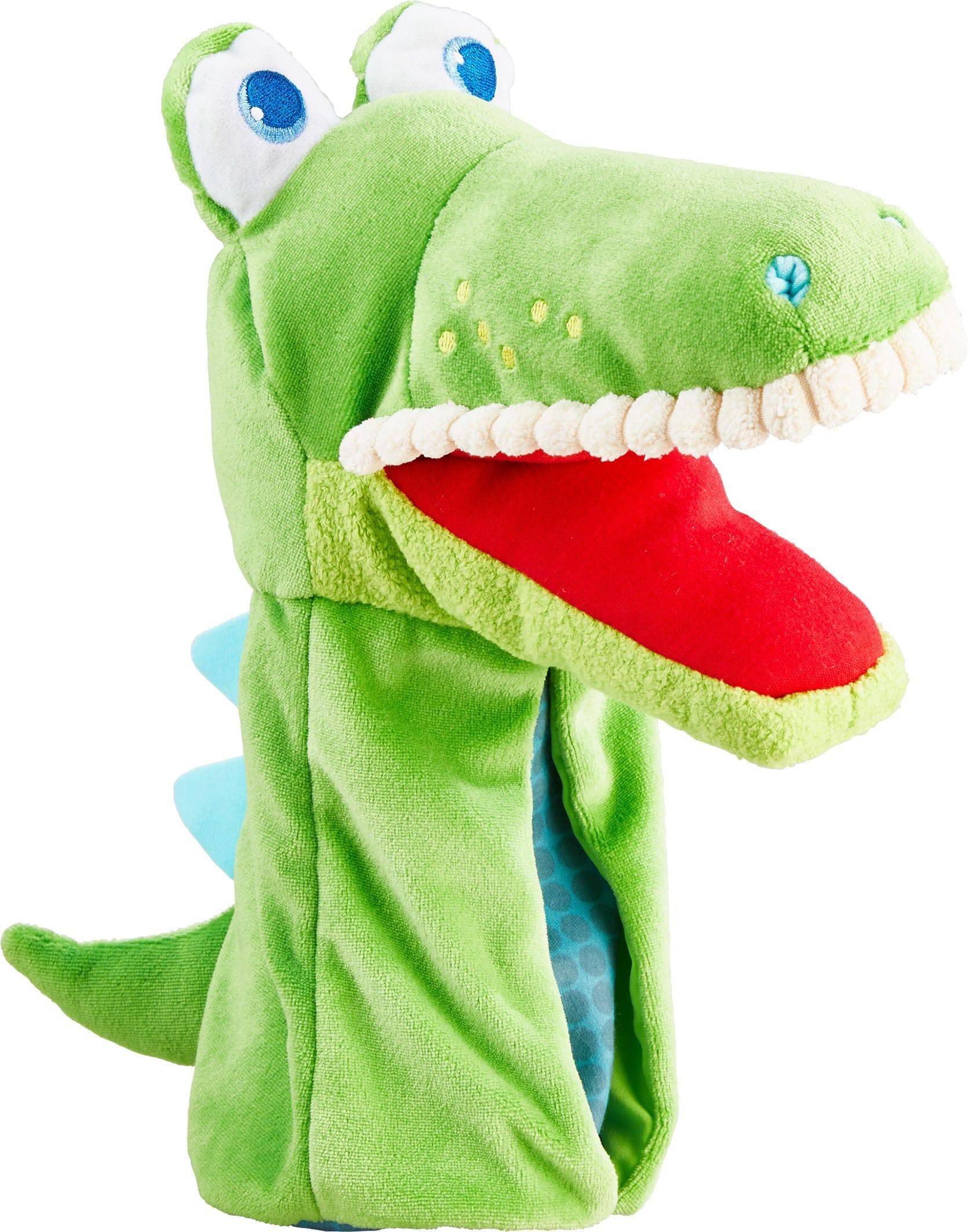 Green dinosaur-shaped plush toy with a red mouth on a white background