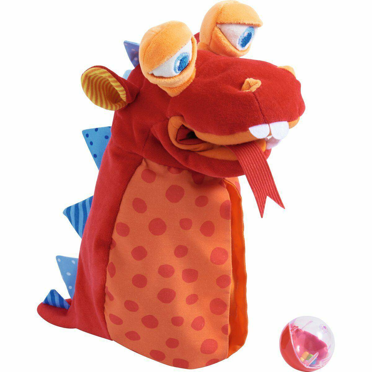 Plush toy resembling a dragon with red and orange colors on a white background