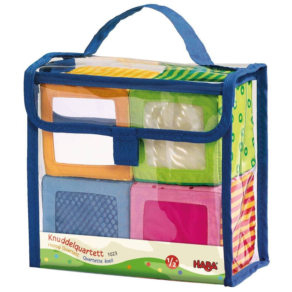 Colorful toy blocks in a transparent bag with blue handle, featuring HABA branding.