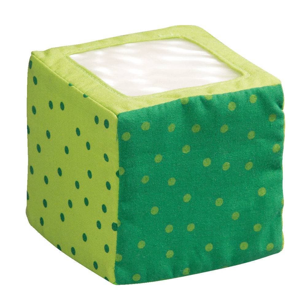 Green cube-shaped product with yellow polka dots on a white background