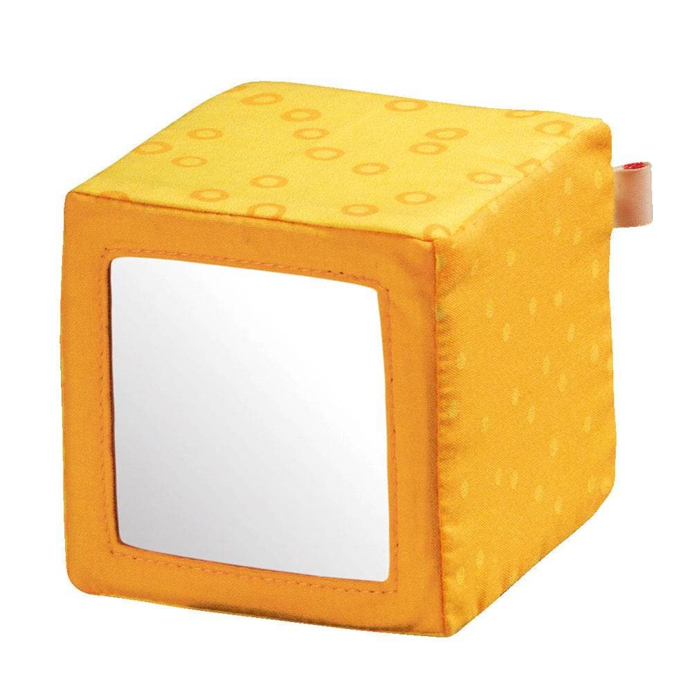 Yellow cube-shaped mirror with a white center on a white background
