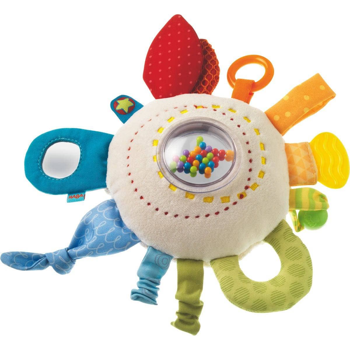 Colorful baby toy with various textures and shapes on a white background