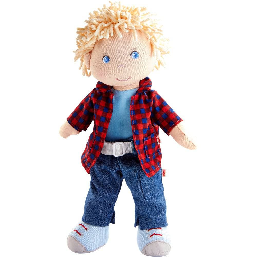 Toy doll with blonde hair, blue eyes, red plaid shirt, blue jeans, and white belt on a white background