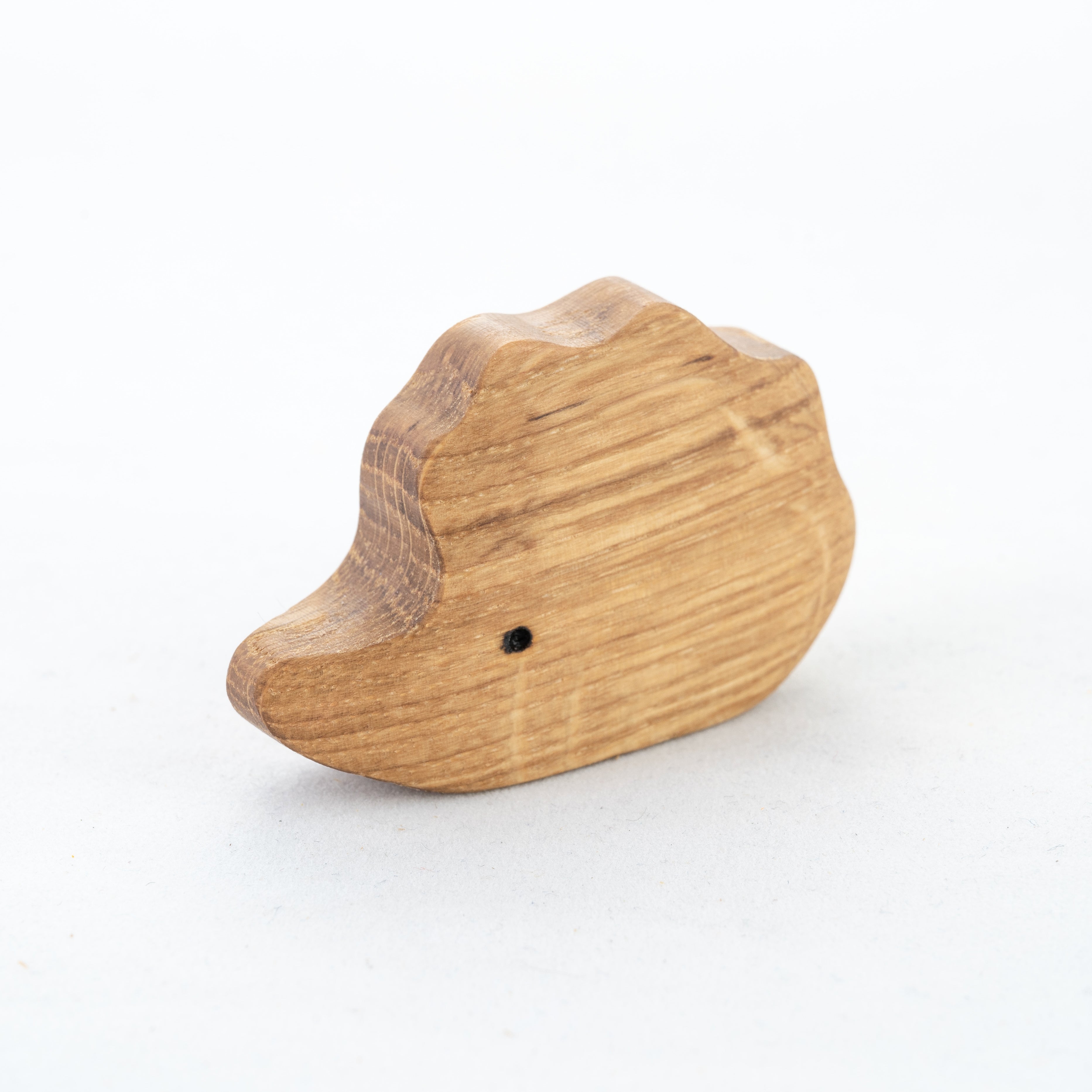 Wooden toy duck on a white background