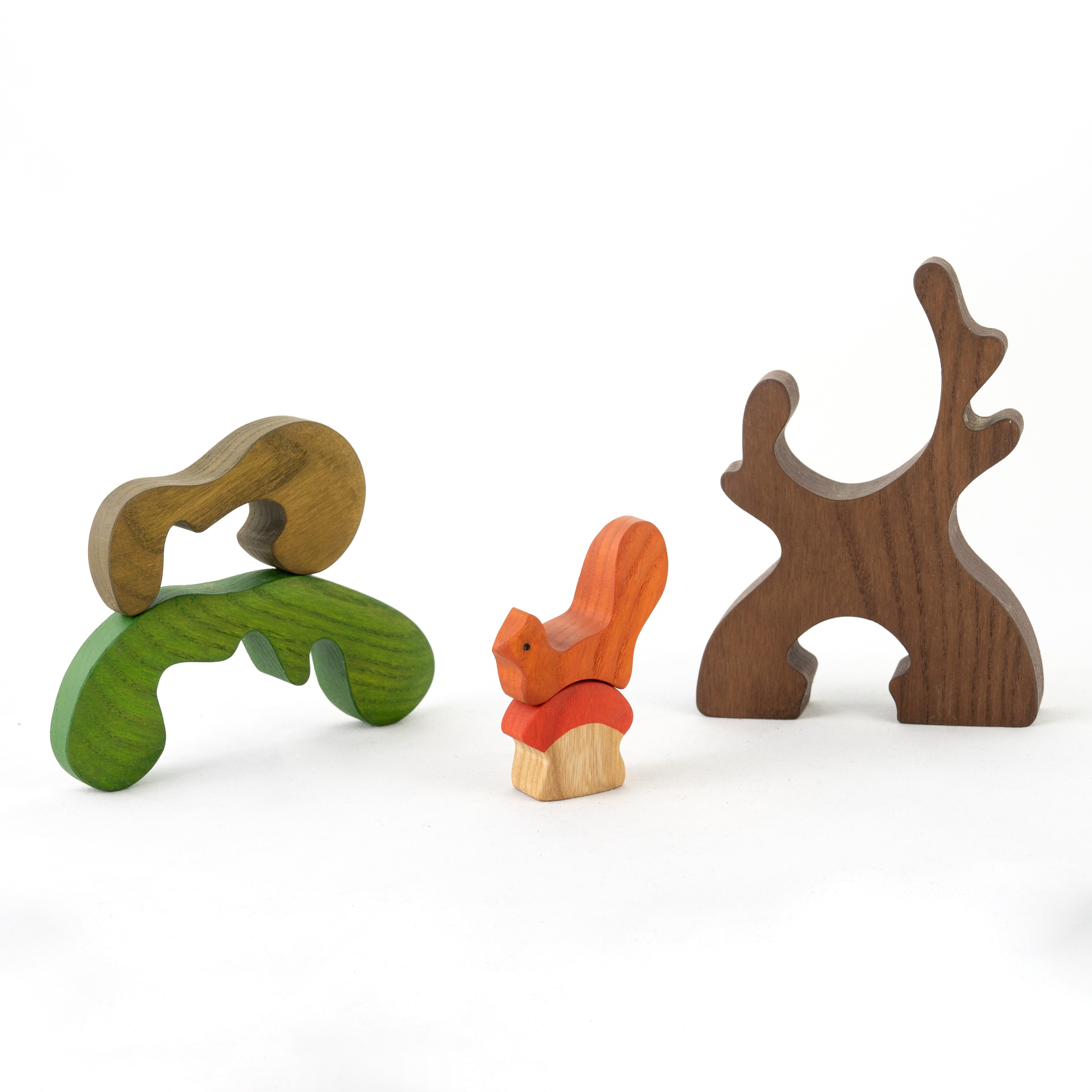 Set of wooden animal toys on a white background