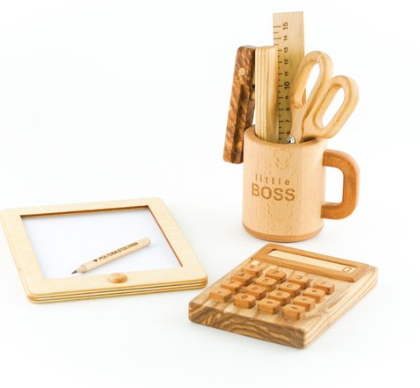 Set of wooden office supplies including a mug, calculator, ruler, and frame on a white background.