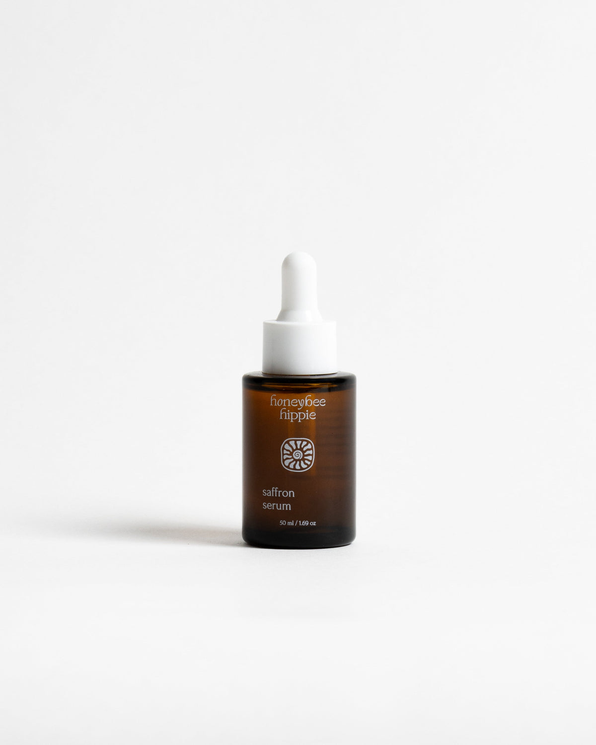 A small amber glass dropper bottle of hair serum with a white dropper cap, centered on a clean white background. The label reads 'curemycology' and 'salmon serum'.