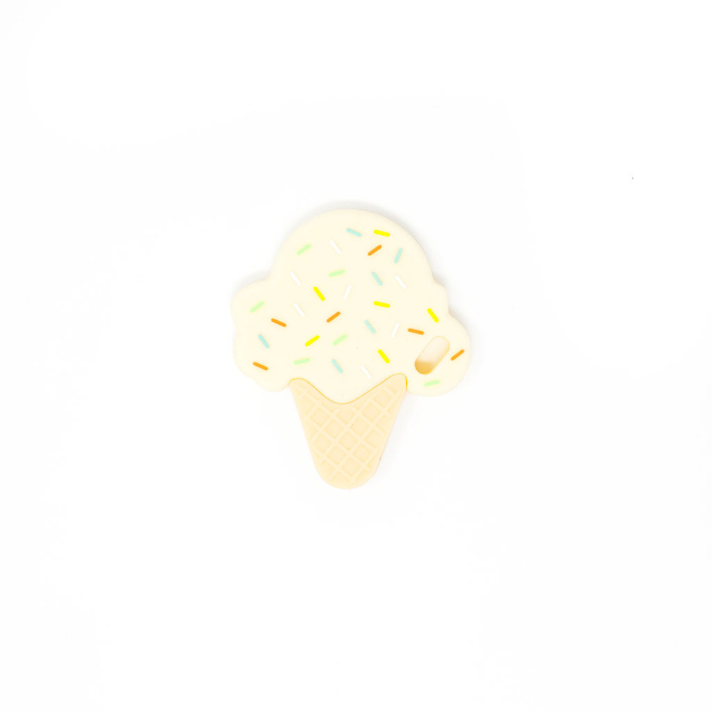 Ice cream cone with white sauce and colorful sprinkles on a white background