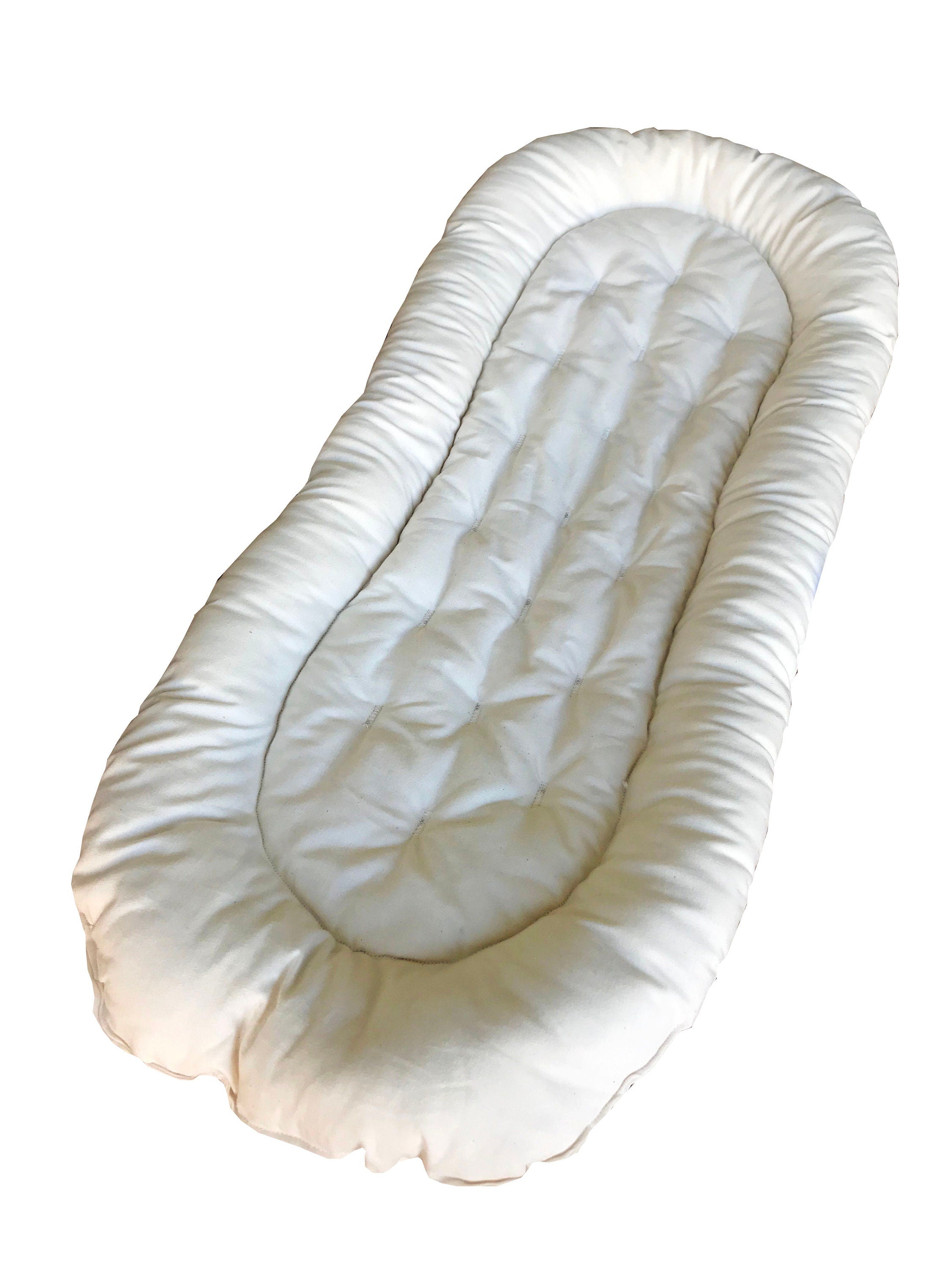 White quilted cover on a white background