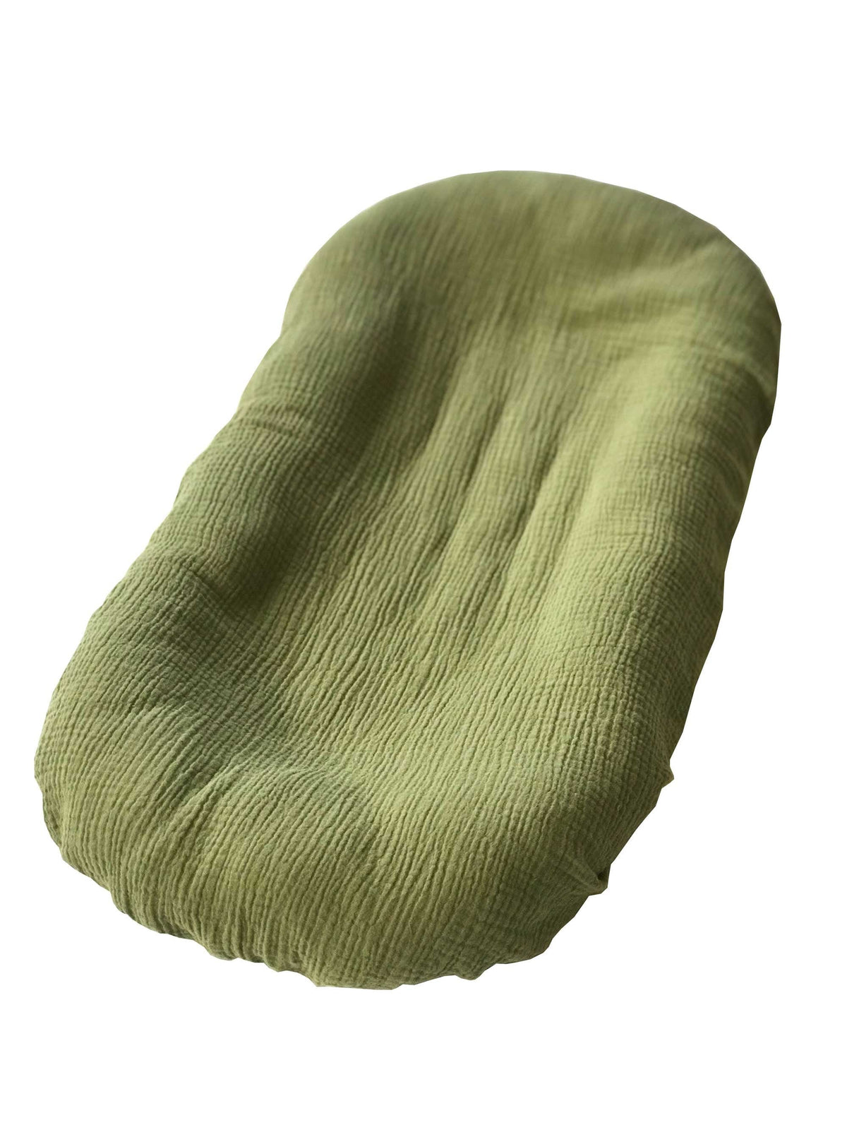 Green knitted item on a white background