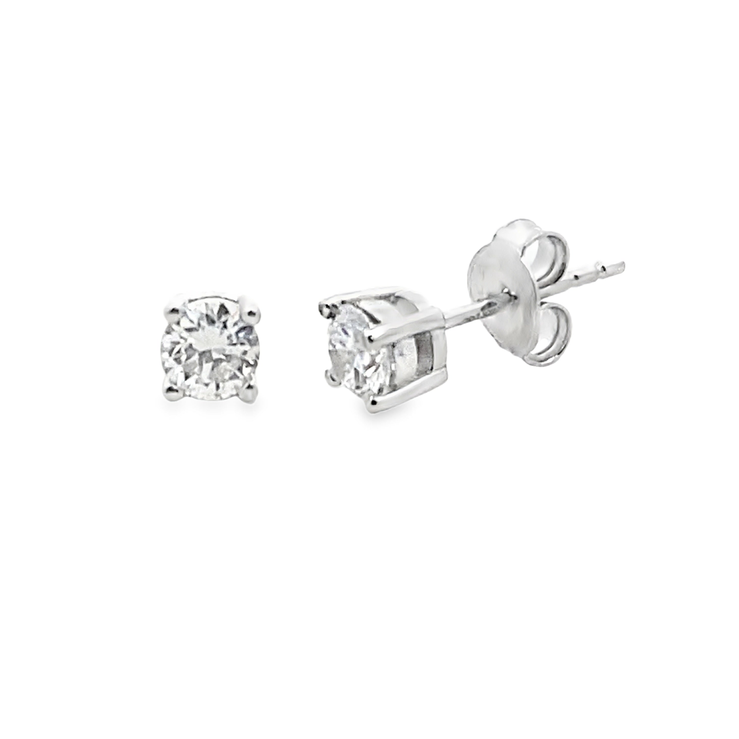 Pair of diamond stud earrings on a white background