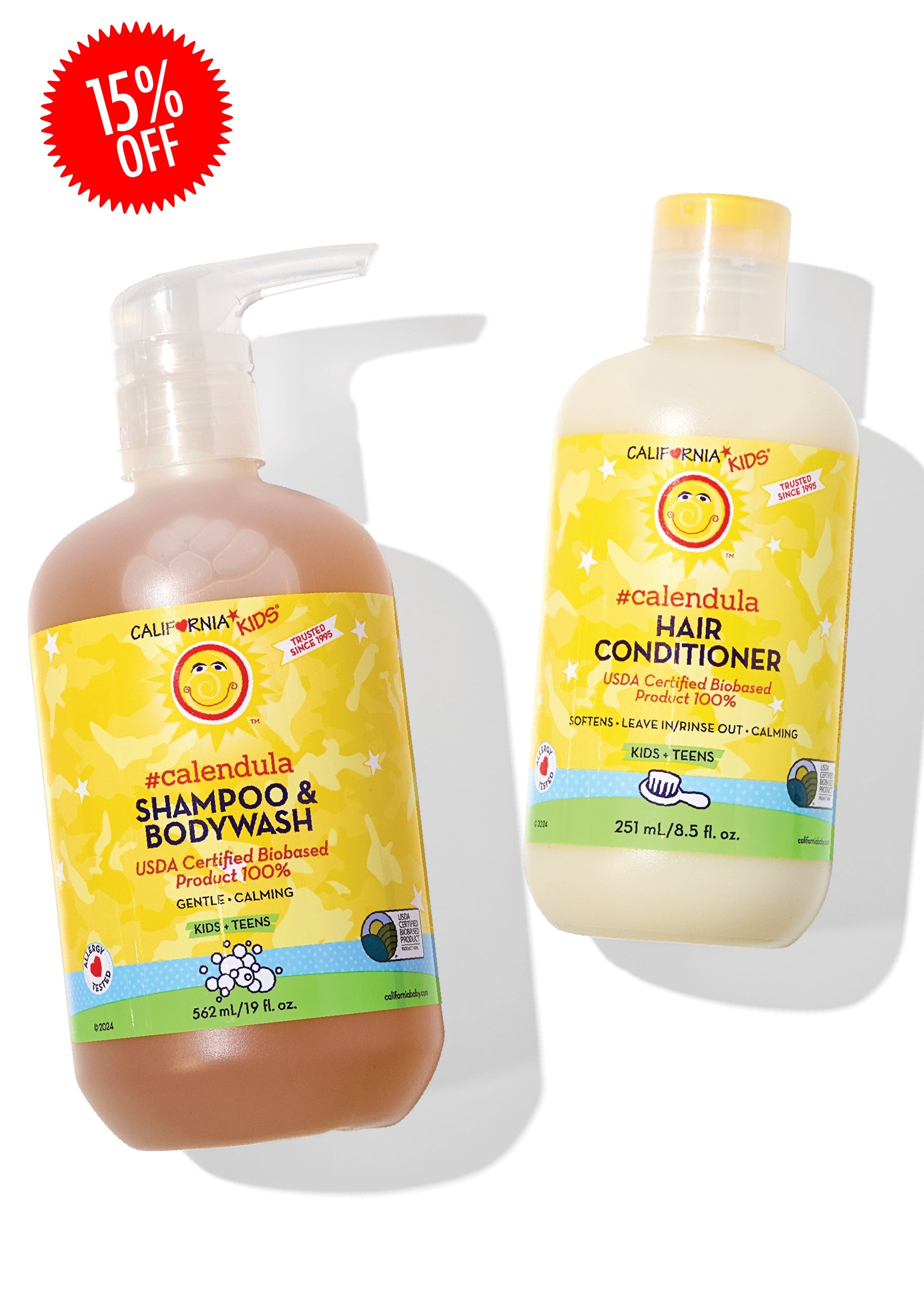 Two bottles of California Kids Calendula shampoo and bodywash with a hair conditioner on a white background.