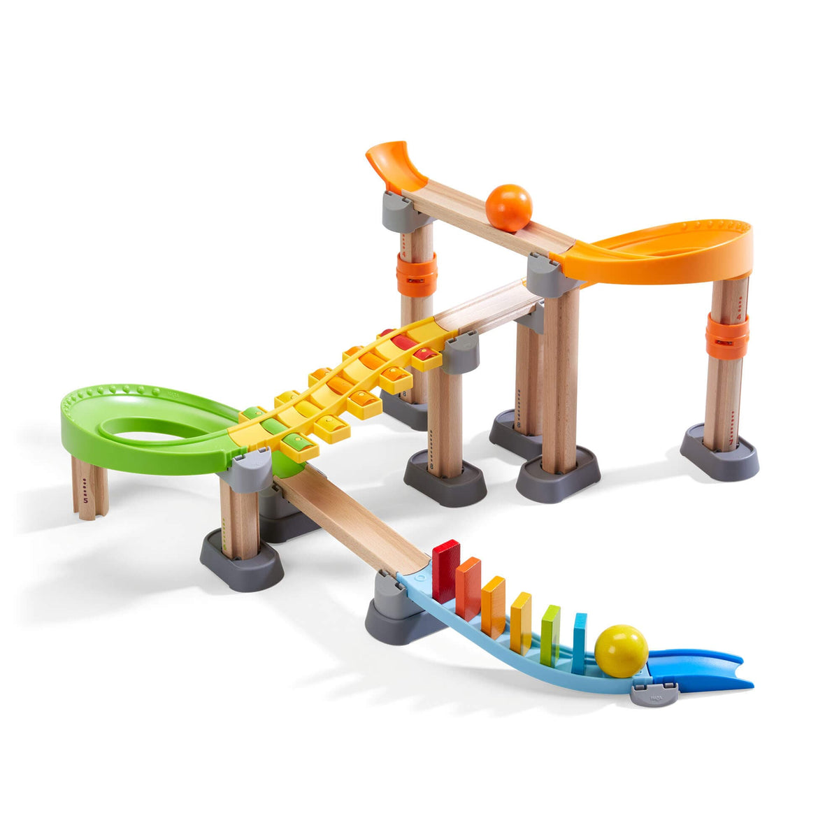 Colorful toy marble run set on a white background