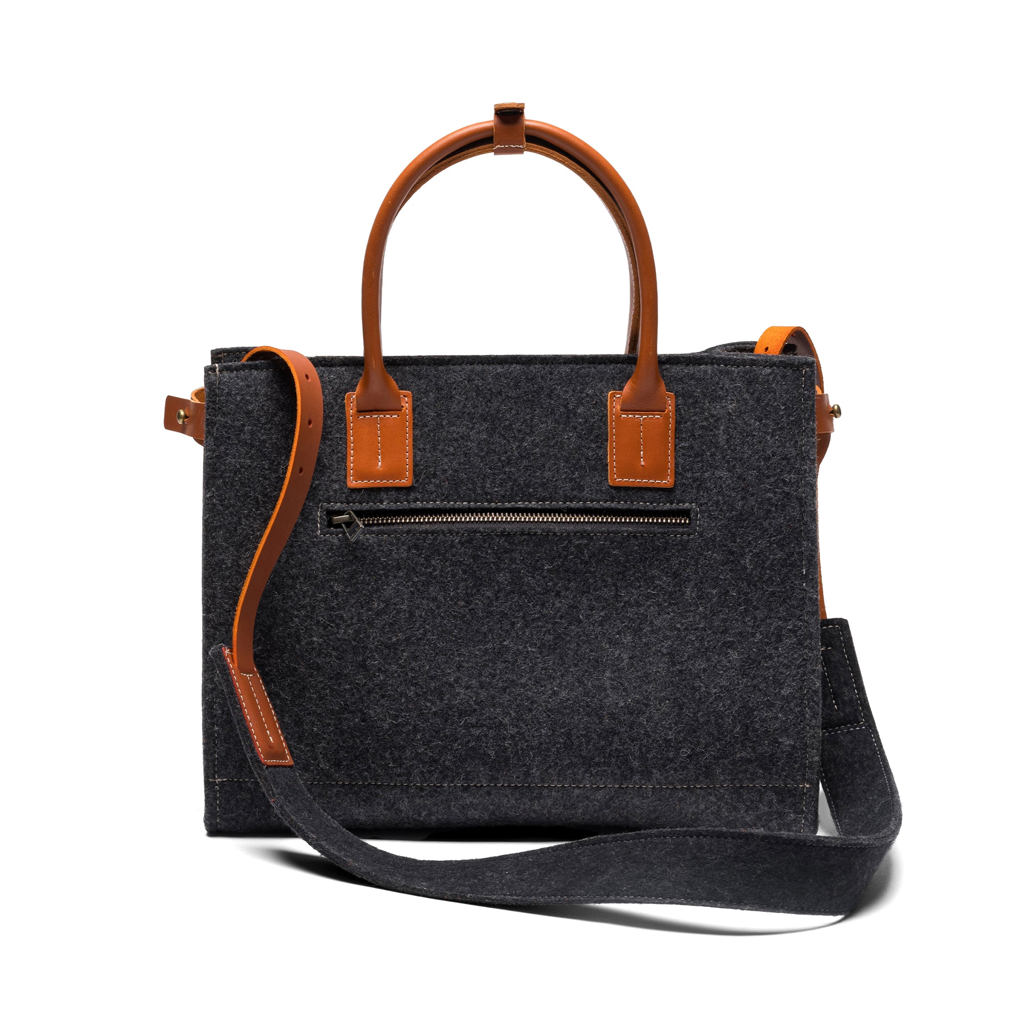 Dark gray handbag with brown leather straps on a white background