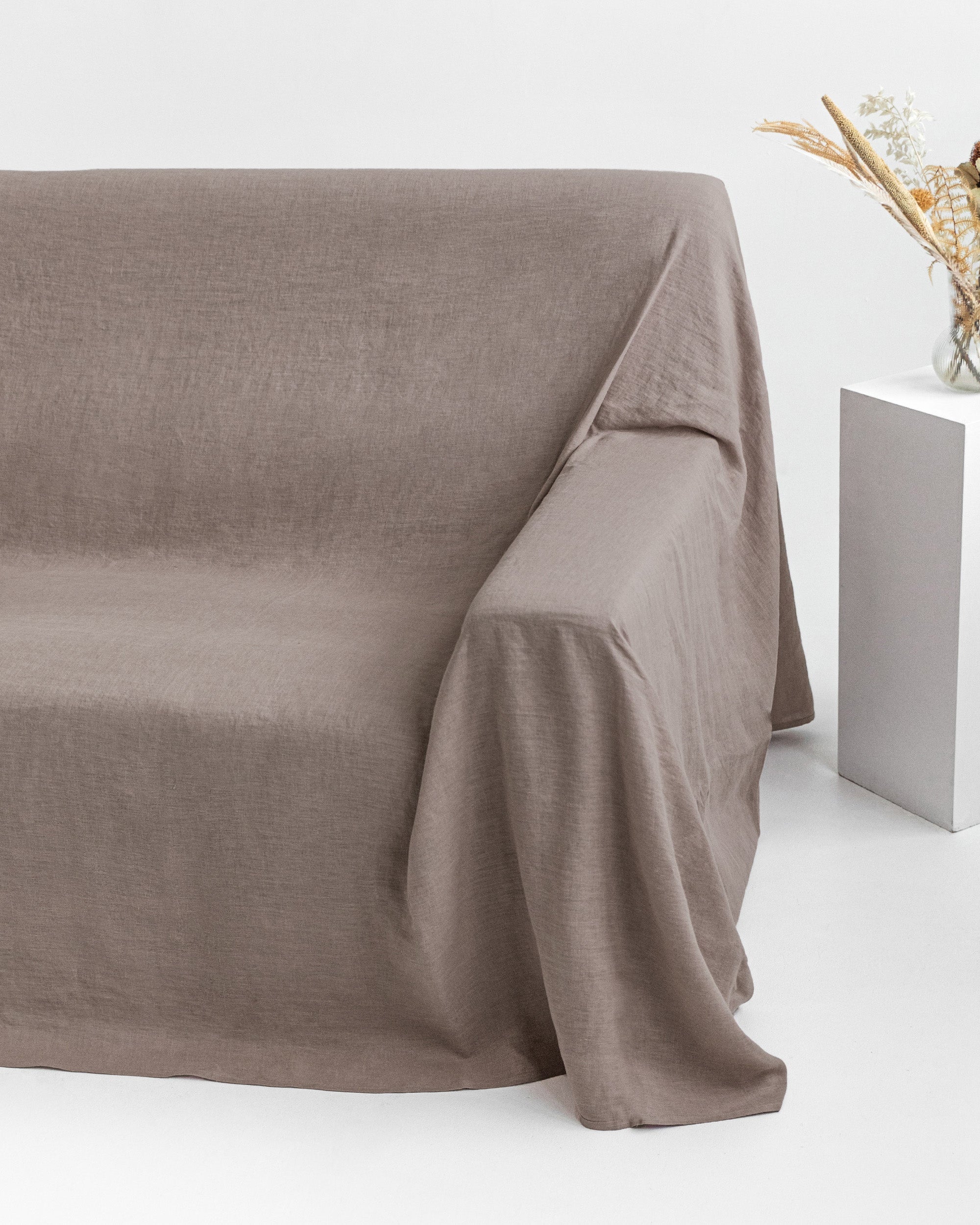 Brown fabric draped over a surface with a minimal background