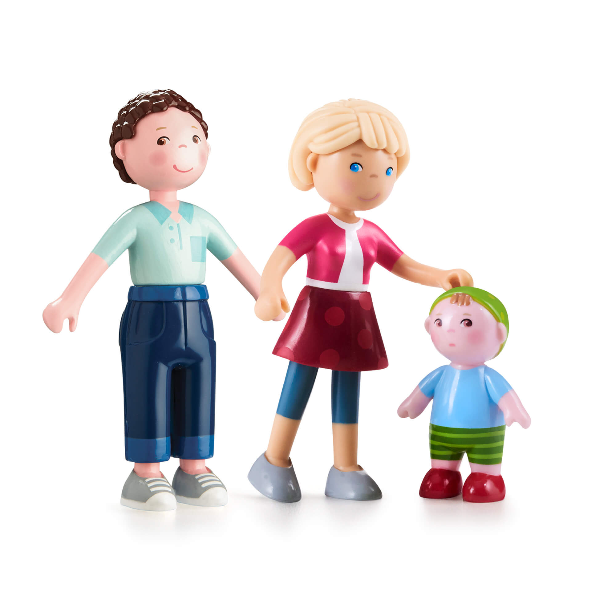 Toy figures of a family on a white background