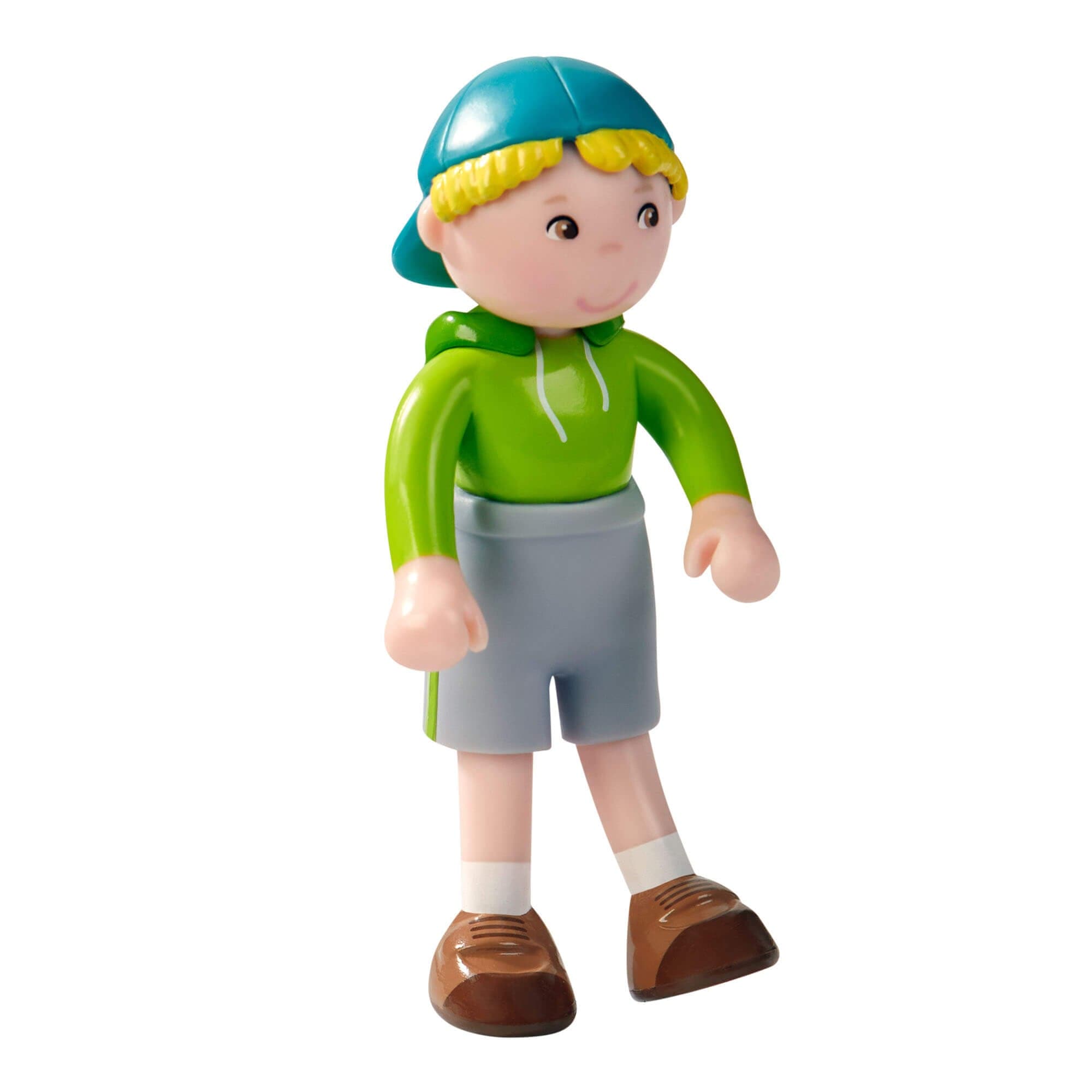 Toy figure of a child wearing a green jacket and blue helmet on a white background