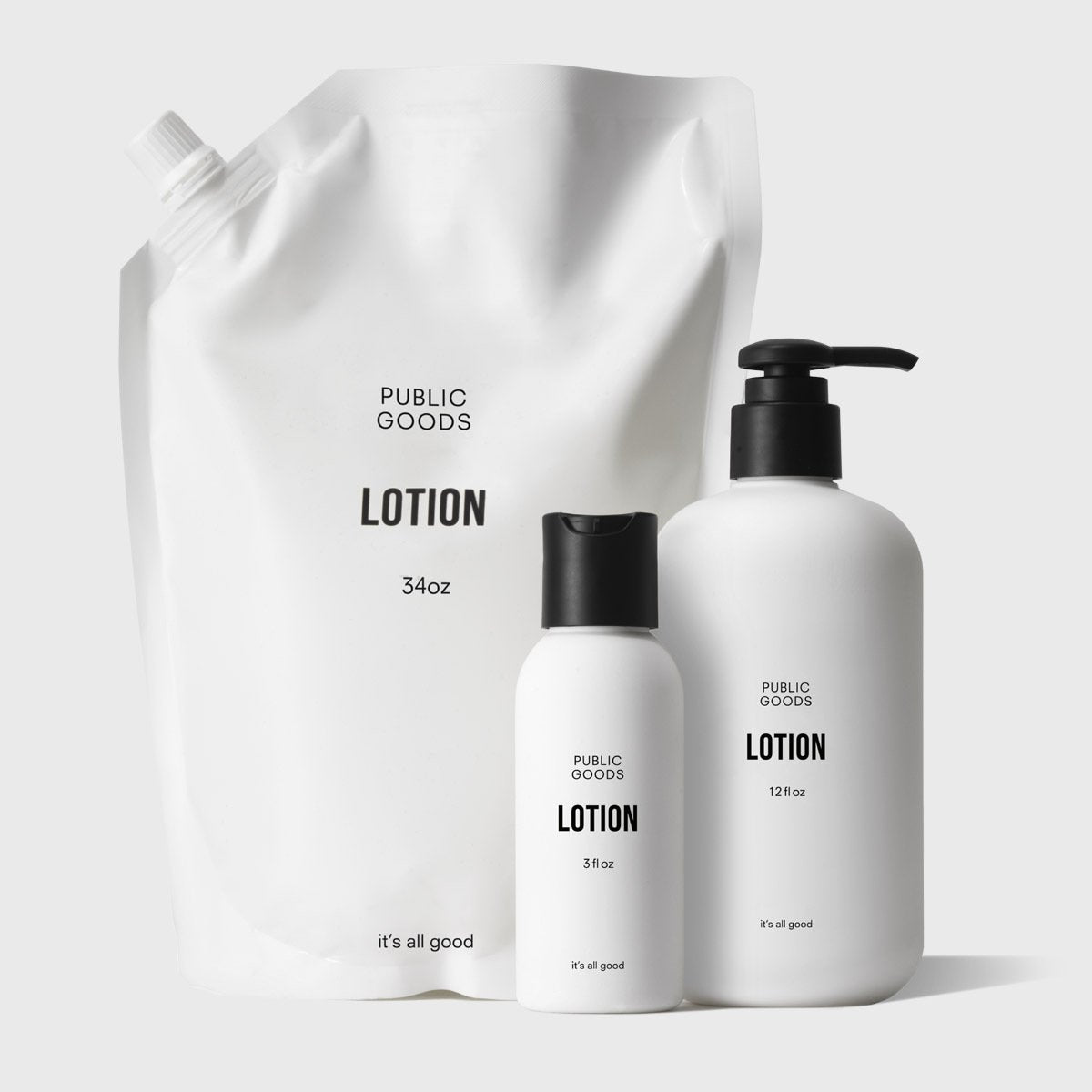 Set of Public Goods lotion bottles and packaging on a white background