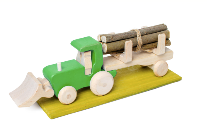 Wooden toy truck with green body, white wheels, and a flatbed carrying logs on a white background.