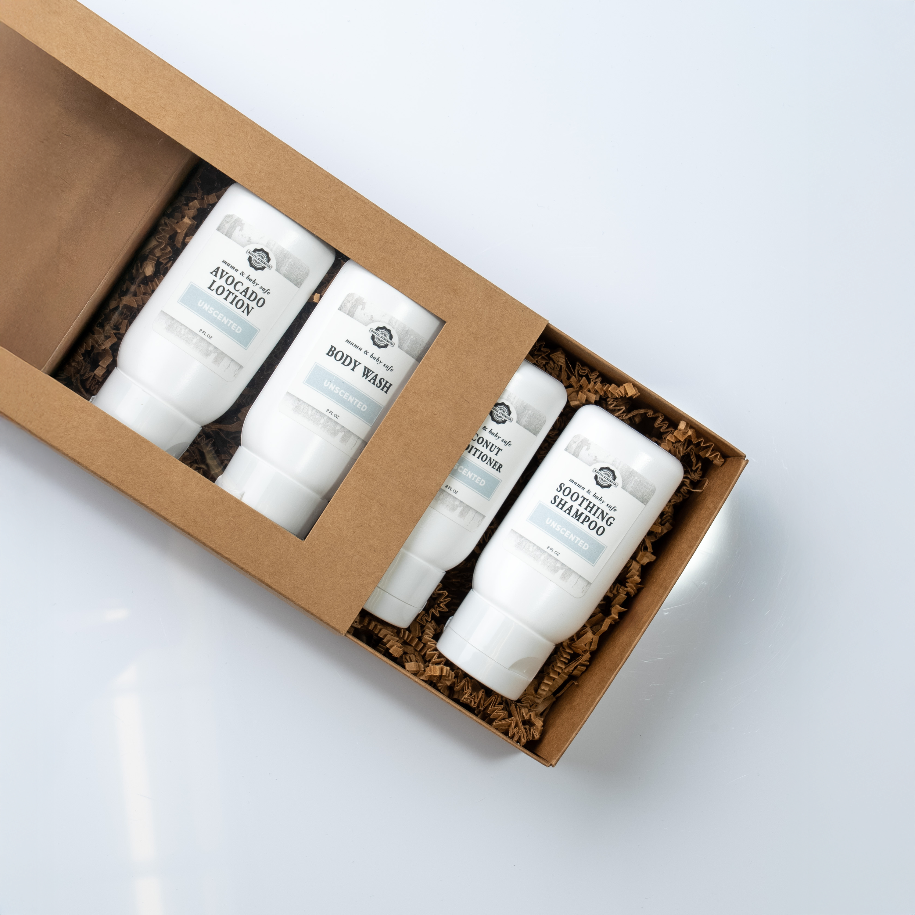 Set of skincare products in a brown box on a white background