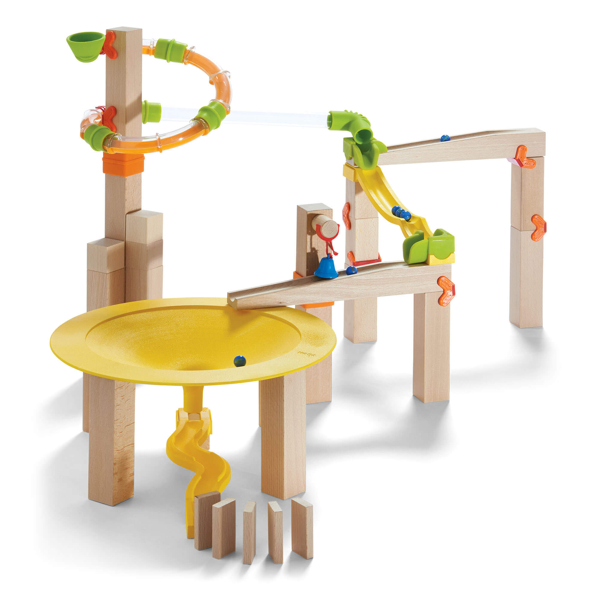 Toy marble run set with wooden tracks and colorful components on a white background