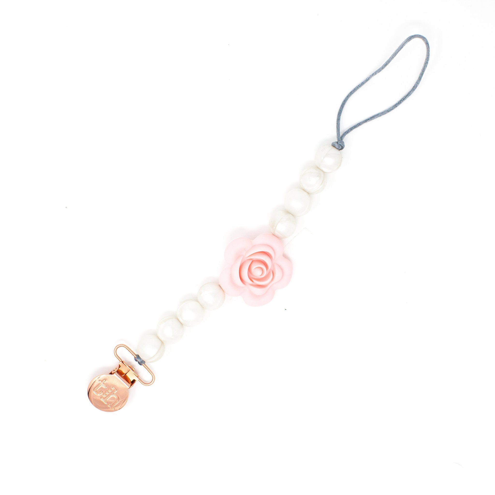 Phone charm with rose design on a white background