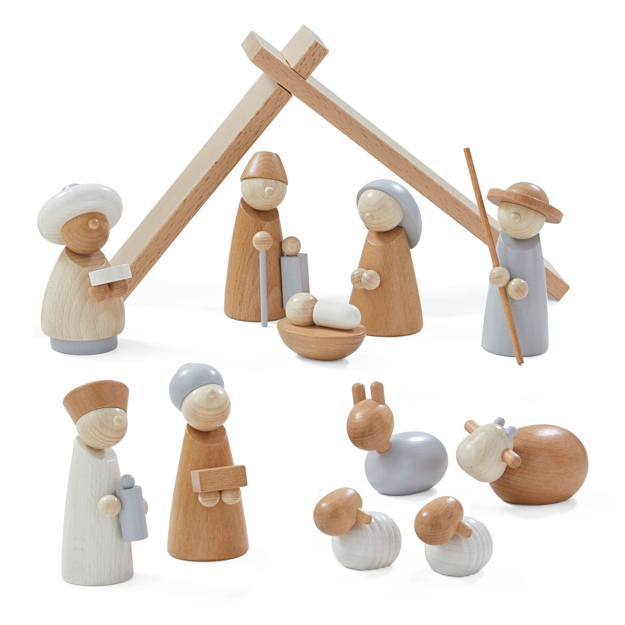 Wooden nativity scene figures with a stable on a white background