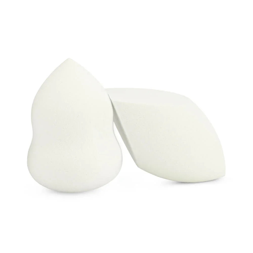 Two white makeup sponges on a white background