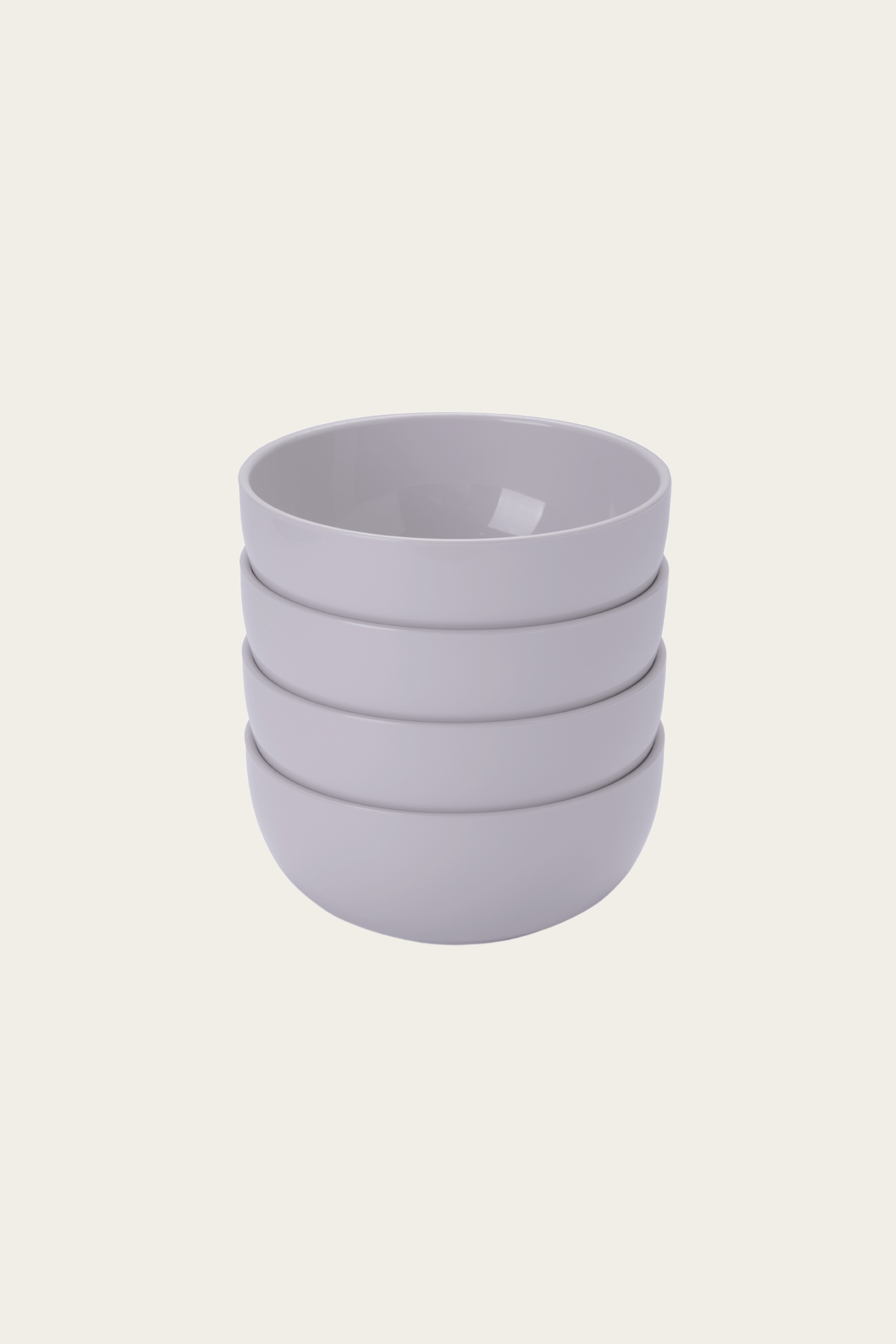 Stack of four light purple ceramic cups on a white background